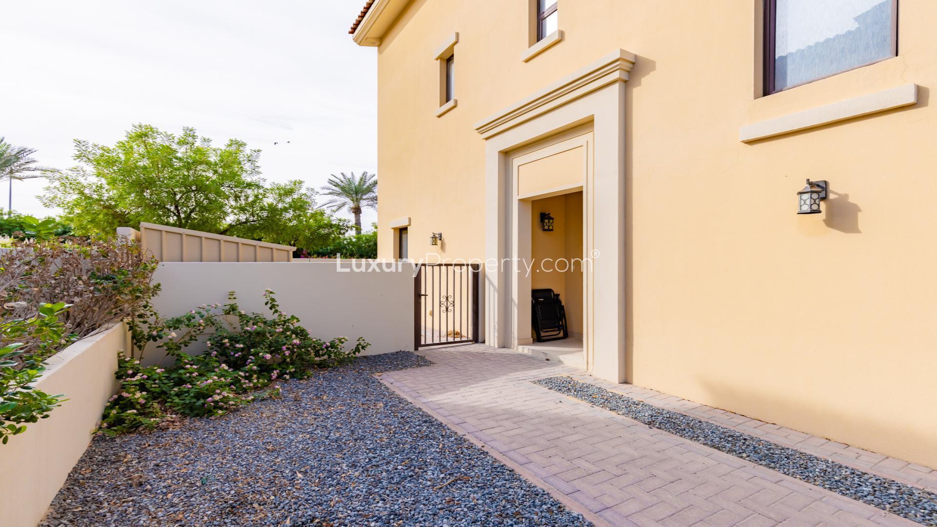 "Spacious living area in chic 3-bedroom villa for rent, Mira, Reem community.","Entrance of chic 3-bedroom villa in Mira, Reem, with landscaped garden and pathway.",Chic 3-bedroom villa interior with large windows and garden view in Mira, Reem