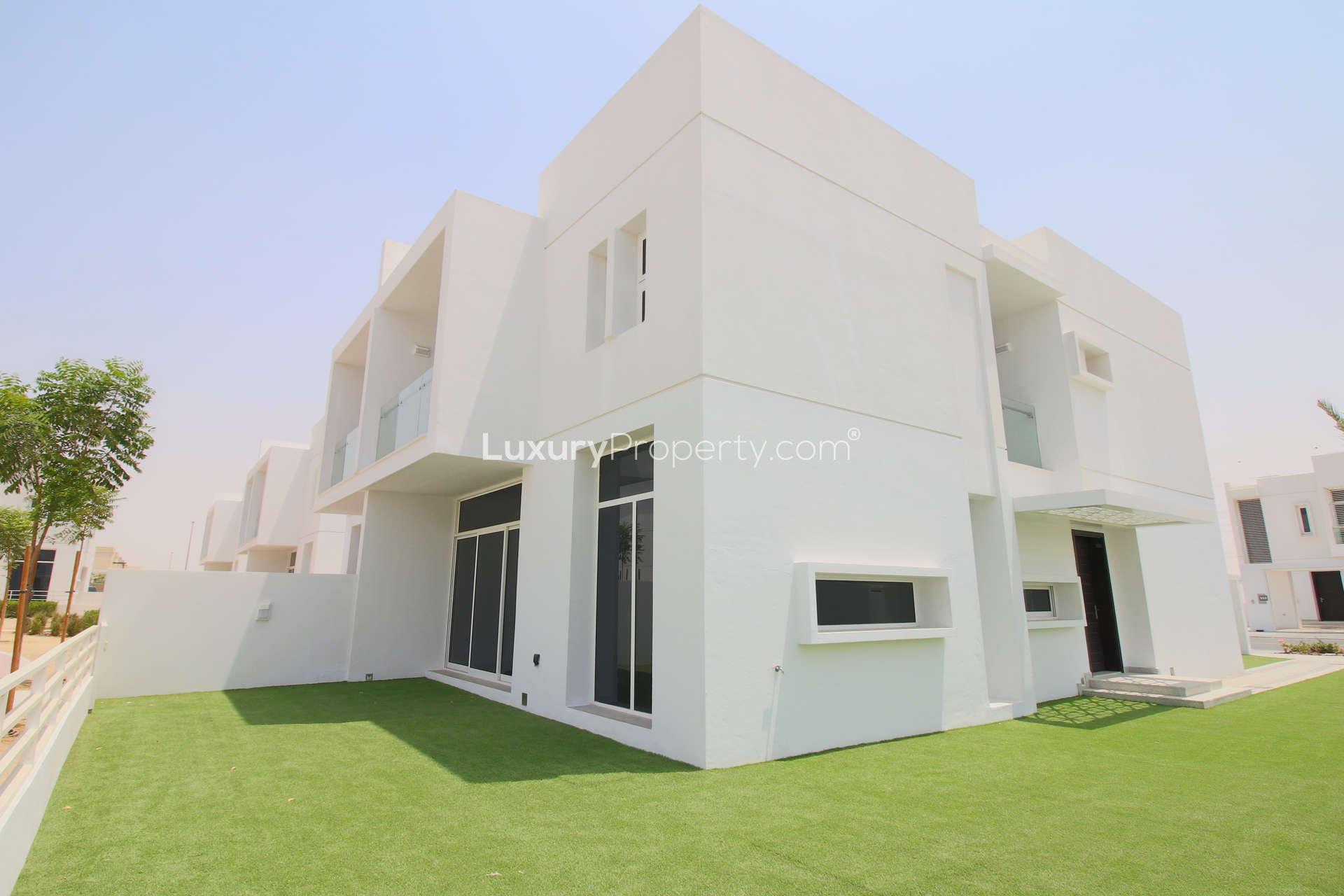 Tennis and basketball court at Arabella 1, Mudon, with modern villas in the background