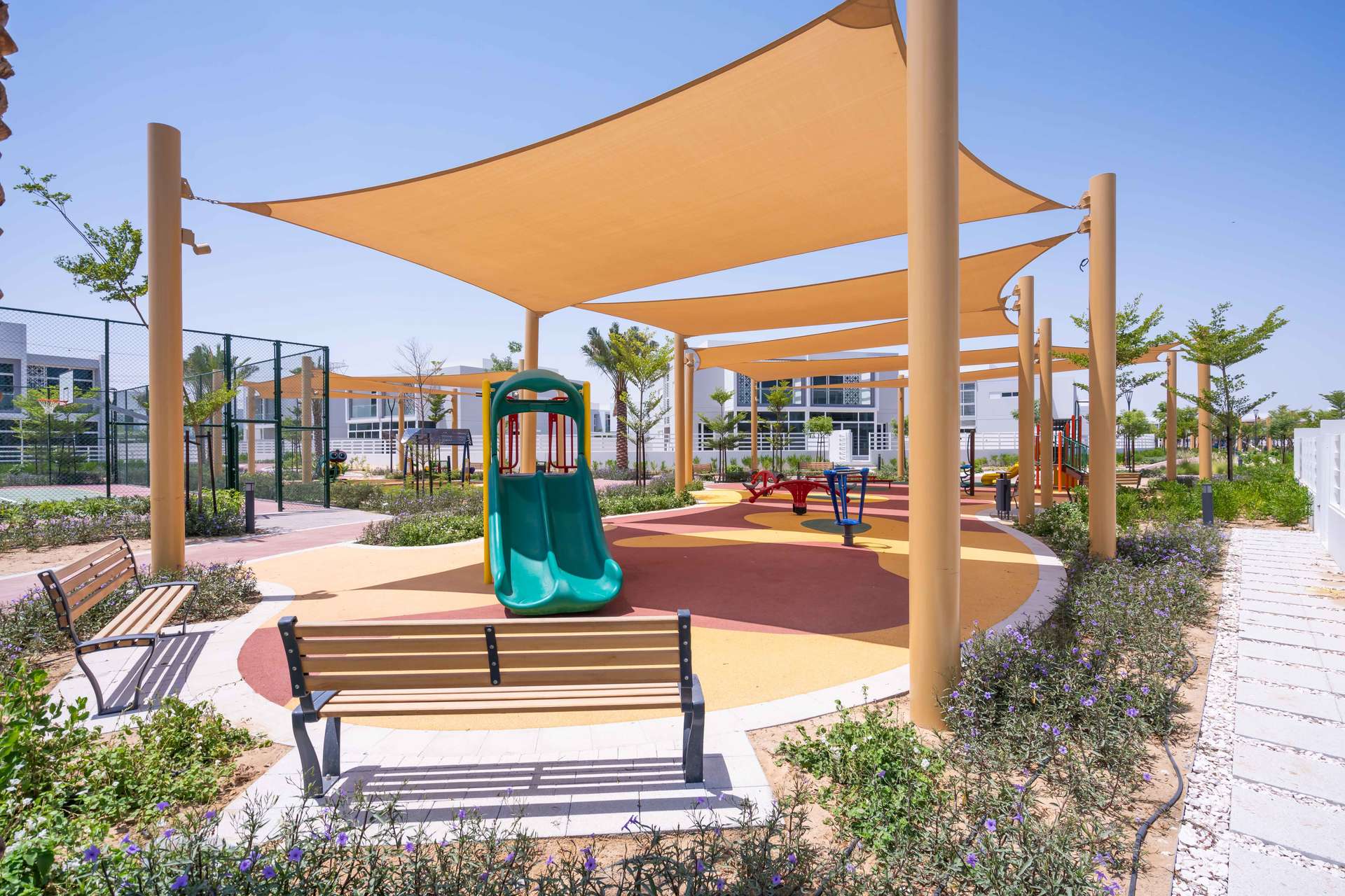 Outdoor pool area with sun loungers in Arabella 1, Mudon, Dubai villa community