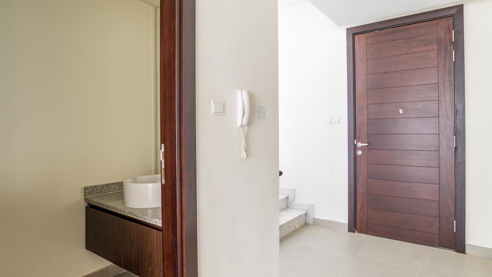 Covered entrance of Arabella Townhouse villa in Mudon community, available for rent