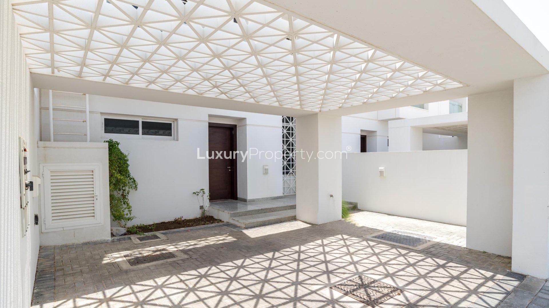 Exterior view of spacious villa yard in Arabella Townhouses, Mudon community