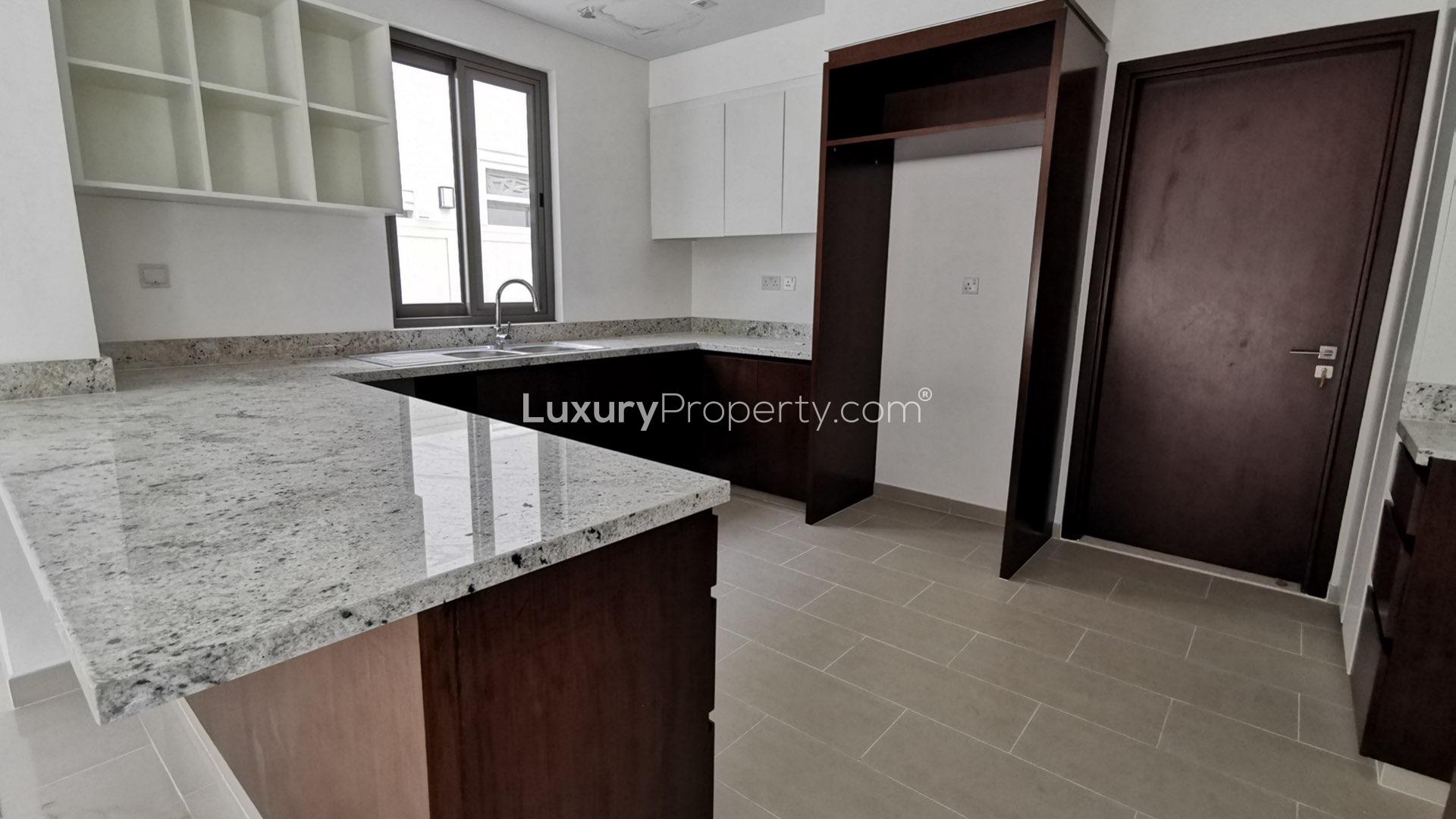 Modern kitchen with granite countertops in Azalea villa, Arabian Ranches 2, for rent