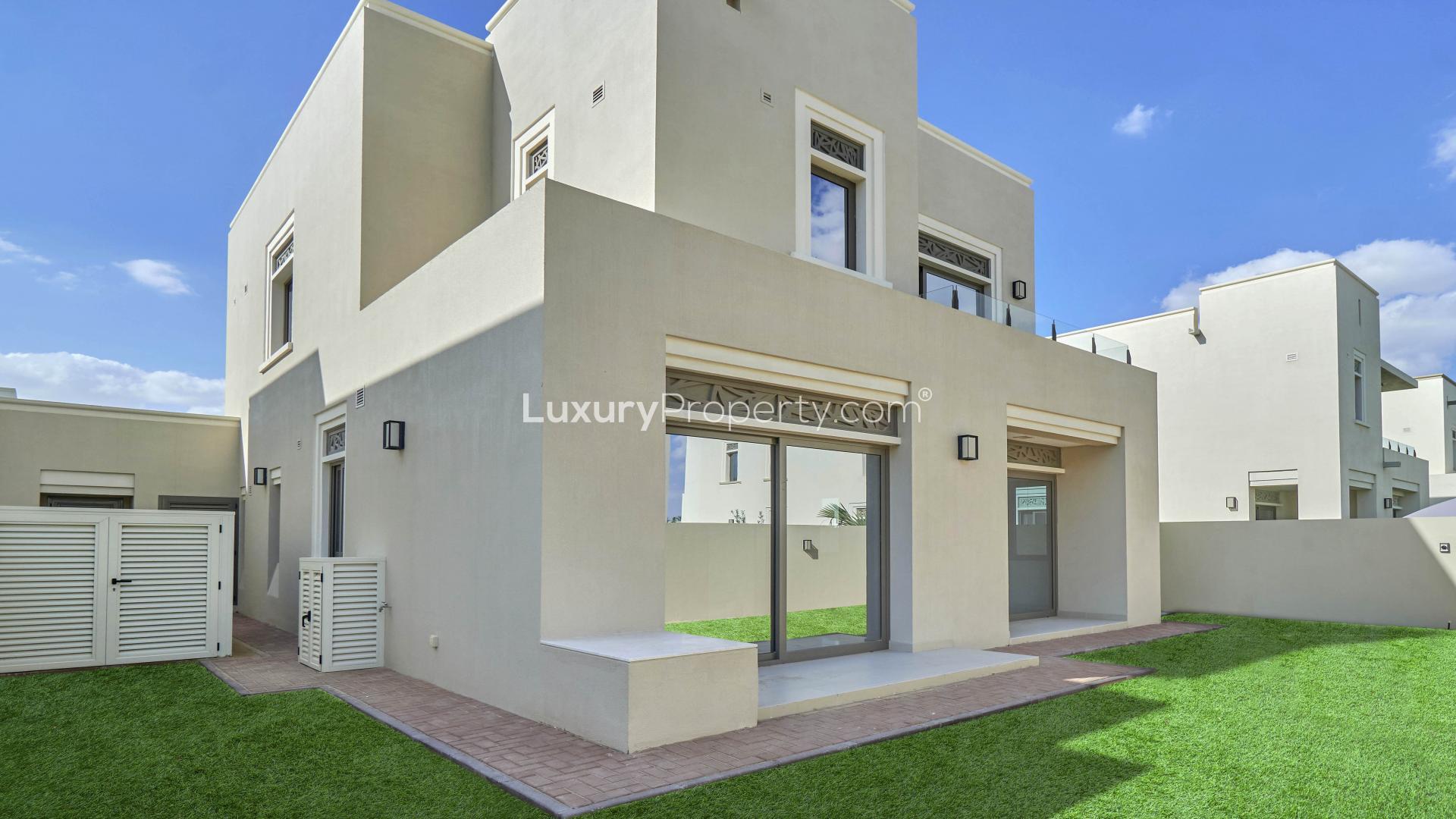 Luxurious 3-bedroom villa exterior in Azalea, Arabian Ranches 2, with green lawn