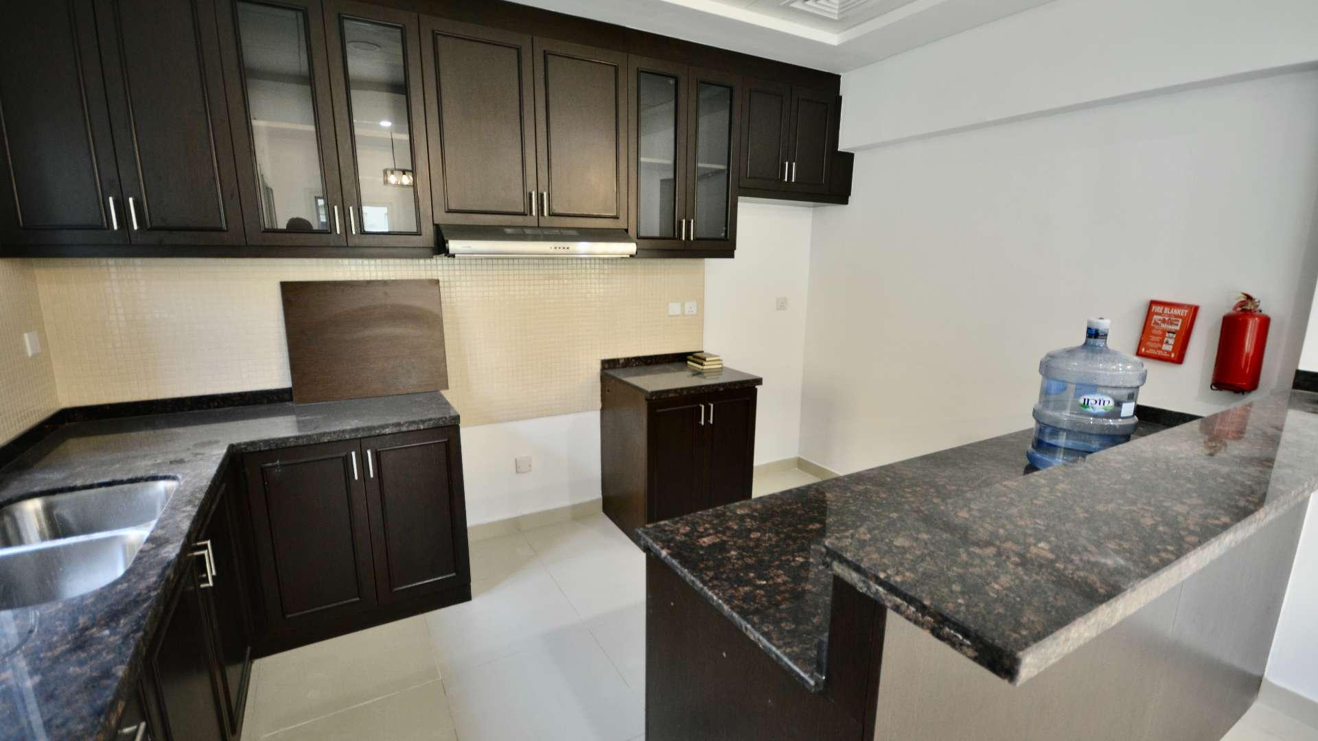 Modern kitchen and living area in Serena Bella Casa townhouse for rent