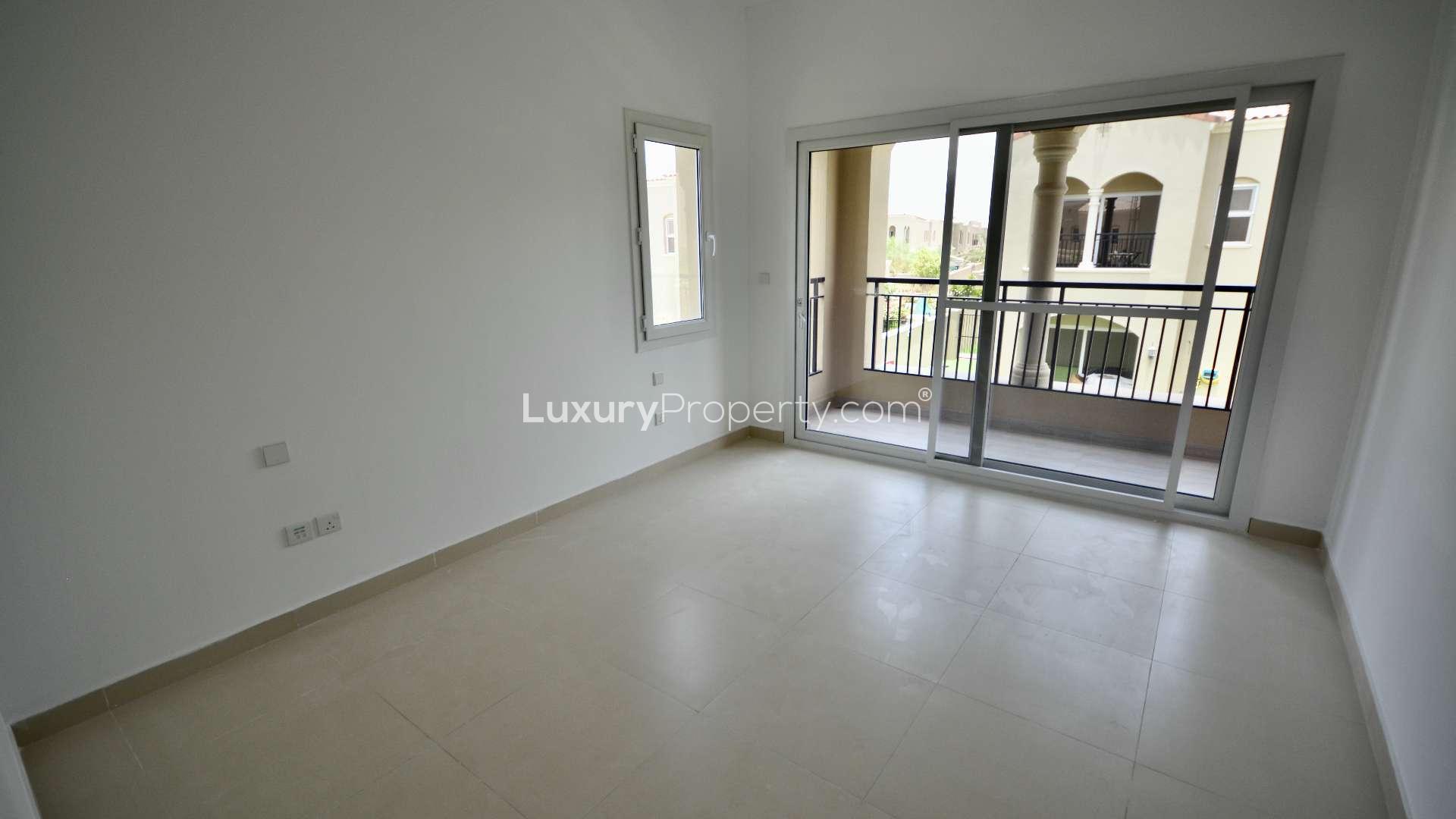 Modern kitchen in exclusive Type B townhouse, Serena Bella Casa, with dark wood cabinets
