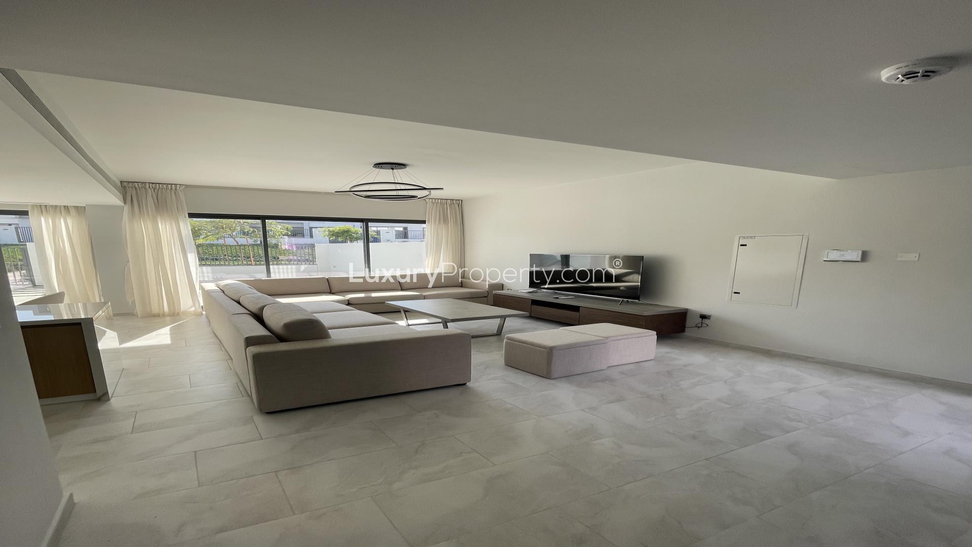 Modern living room in La Rosa villa, Villanova, Dubai Land, featuring spacious open layout