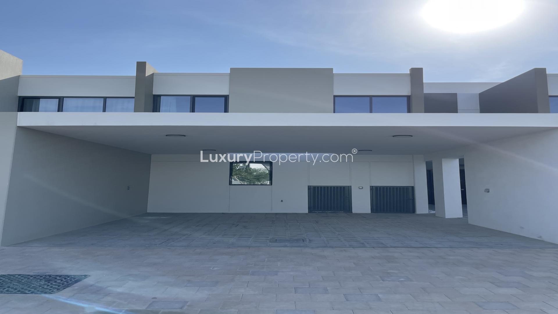 Modern dining area and kitchen in La Rosa villa, Villanova, Dubai Land