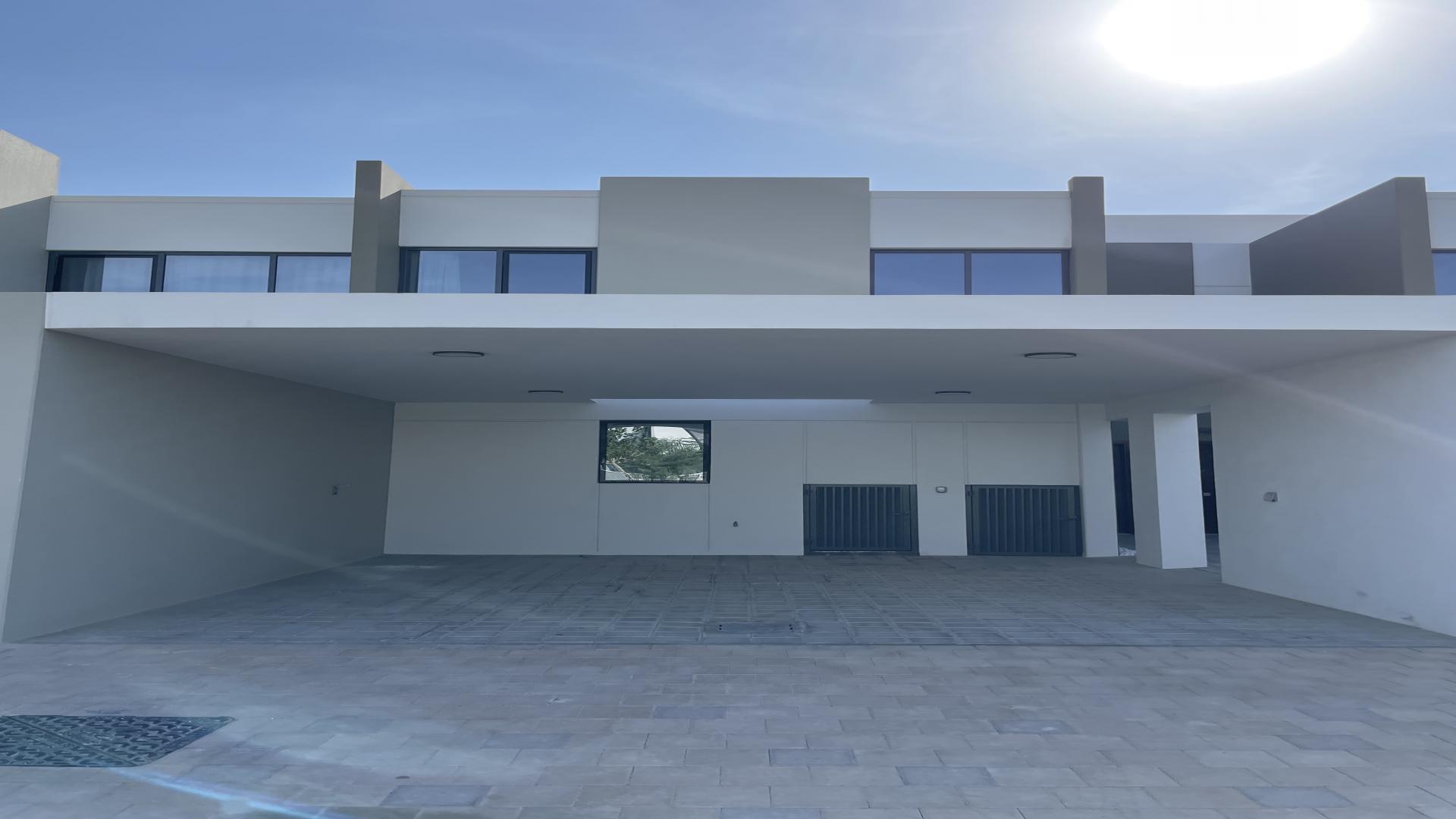 Modern dining area and kitchen in La Rosa villa, Villanova, Dubai Land