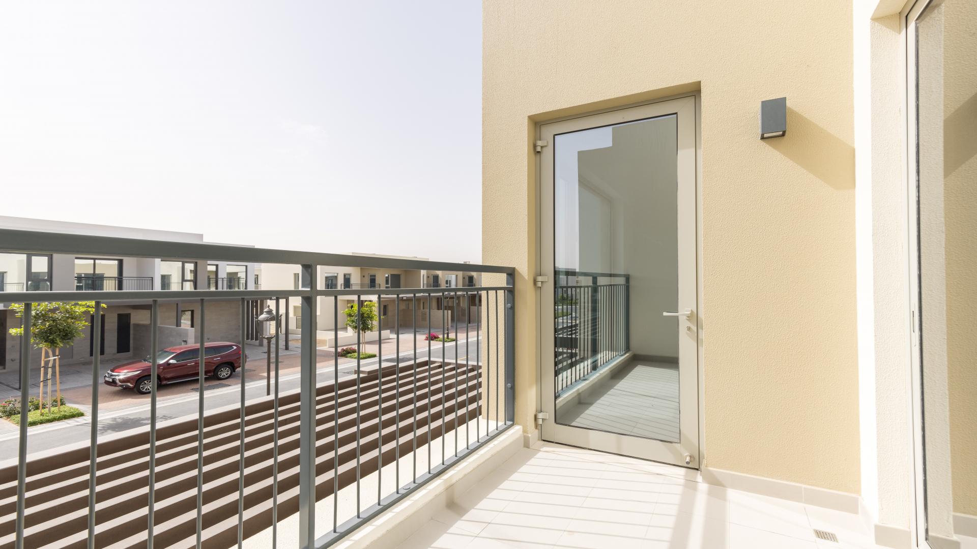 Empty room with large sliding glass doors in Camelia townhouse, Arabian Ranches 2