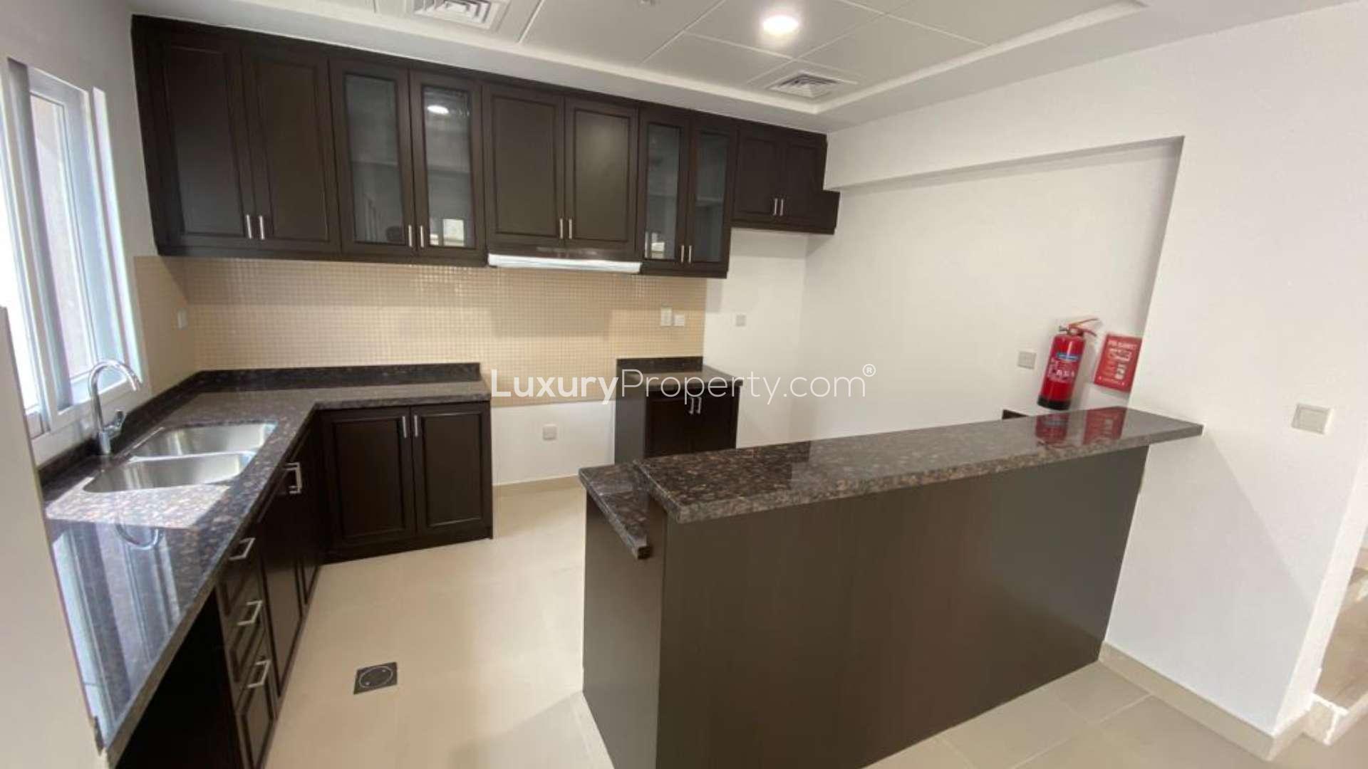 Bright living area in Casa Viva villa, Serena, with large windows and dining setup