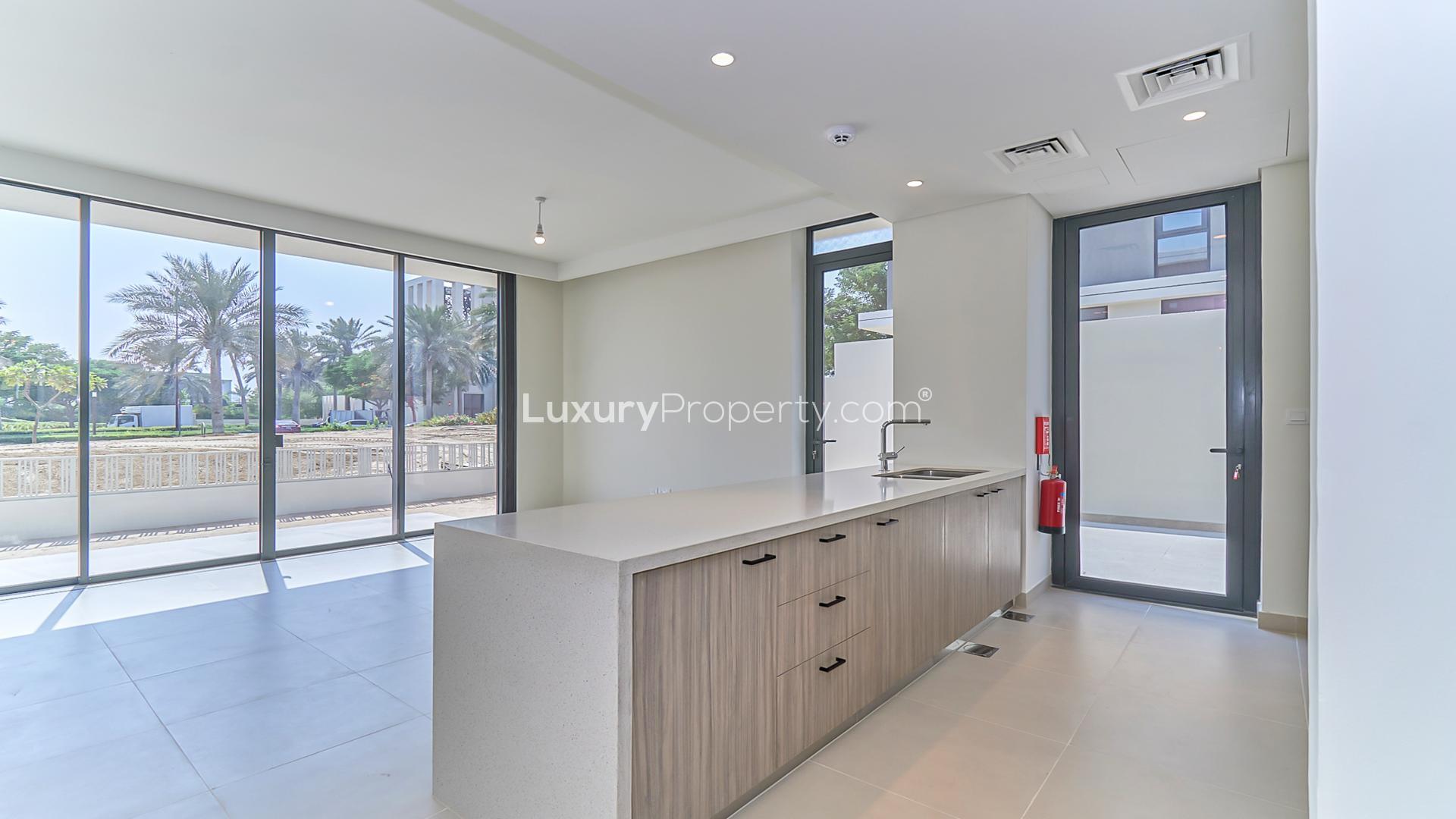 Modern open-plan villa interior with golf course view in Dubai Hills Estate