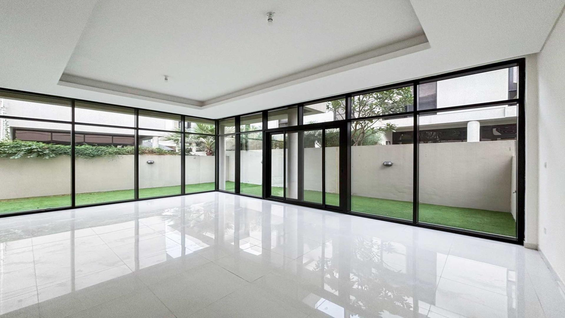 Modern villa exterior with green lawn, Topanga, Damac Hills, available for rent