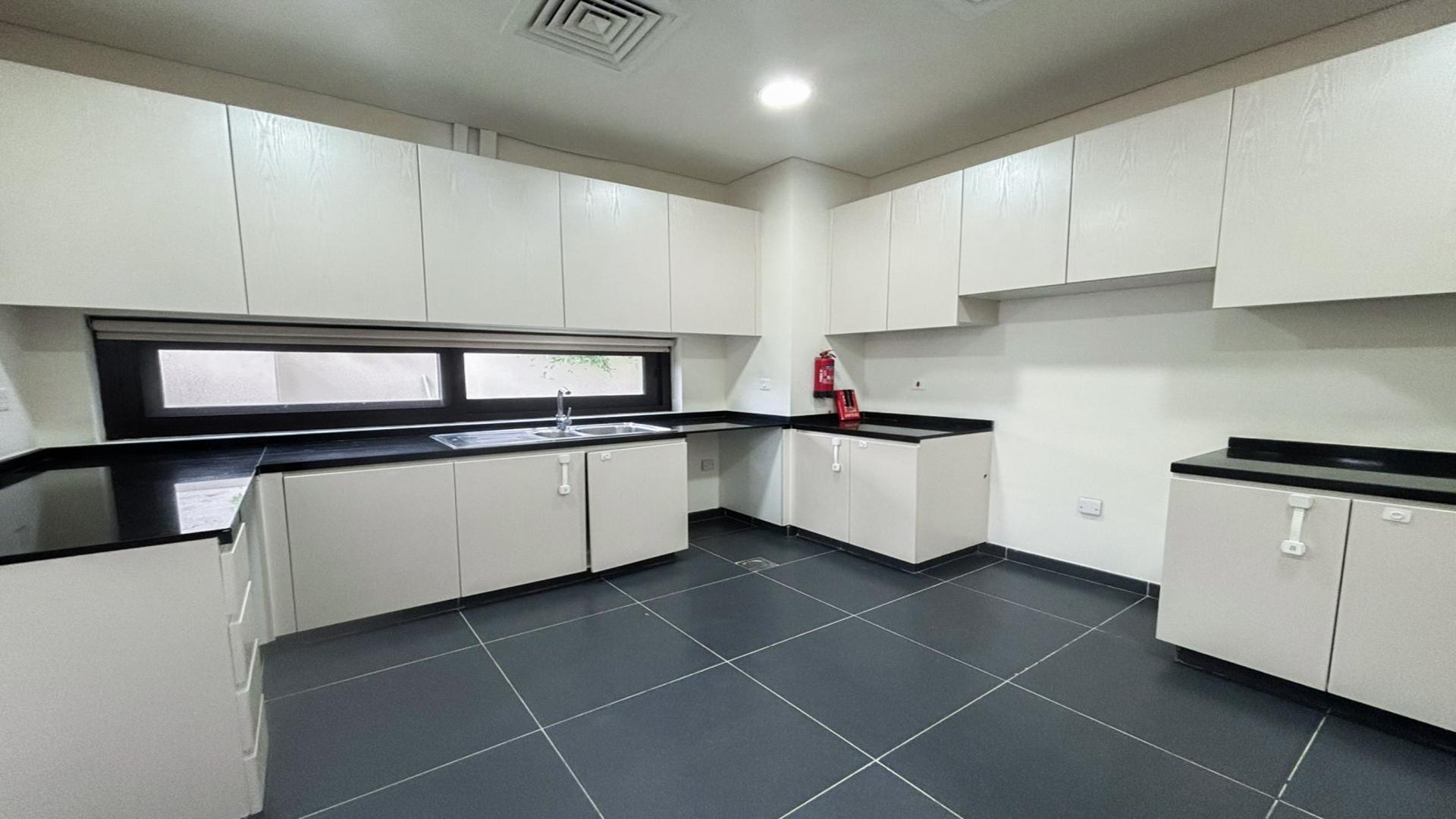 Spacious living room with large windows in Damac Hills Topanga villa for rent