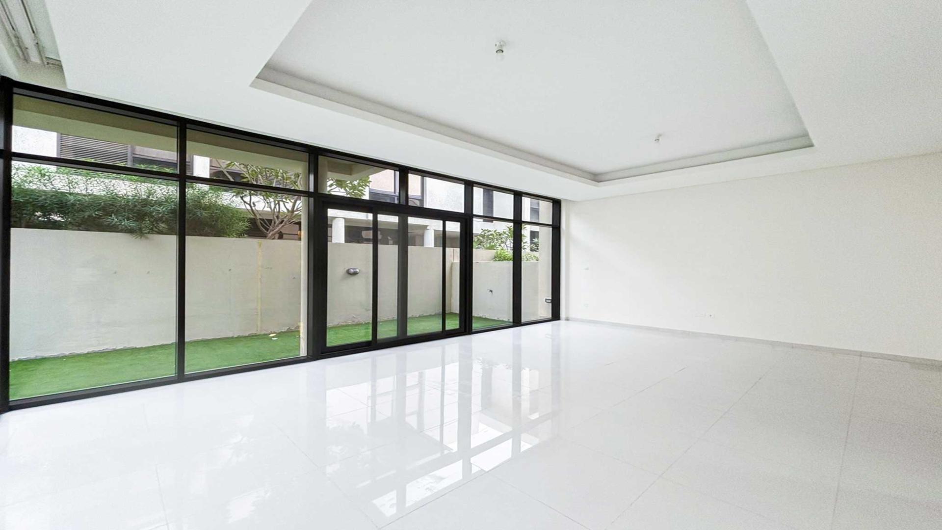 Spacious living room in Topanga villa with large windows and garden view