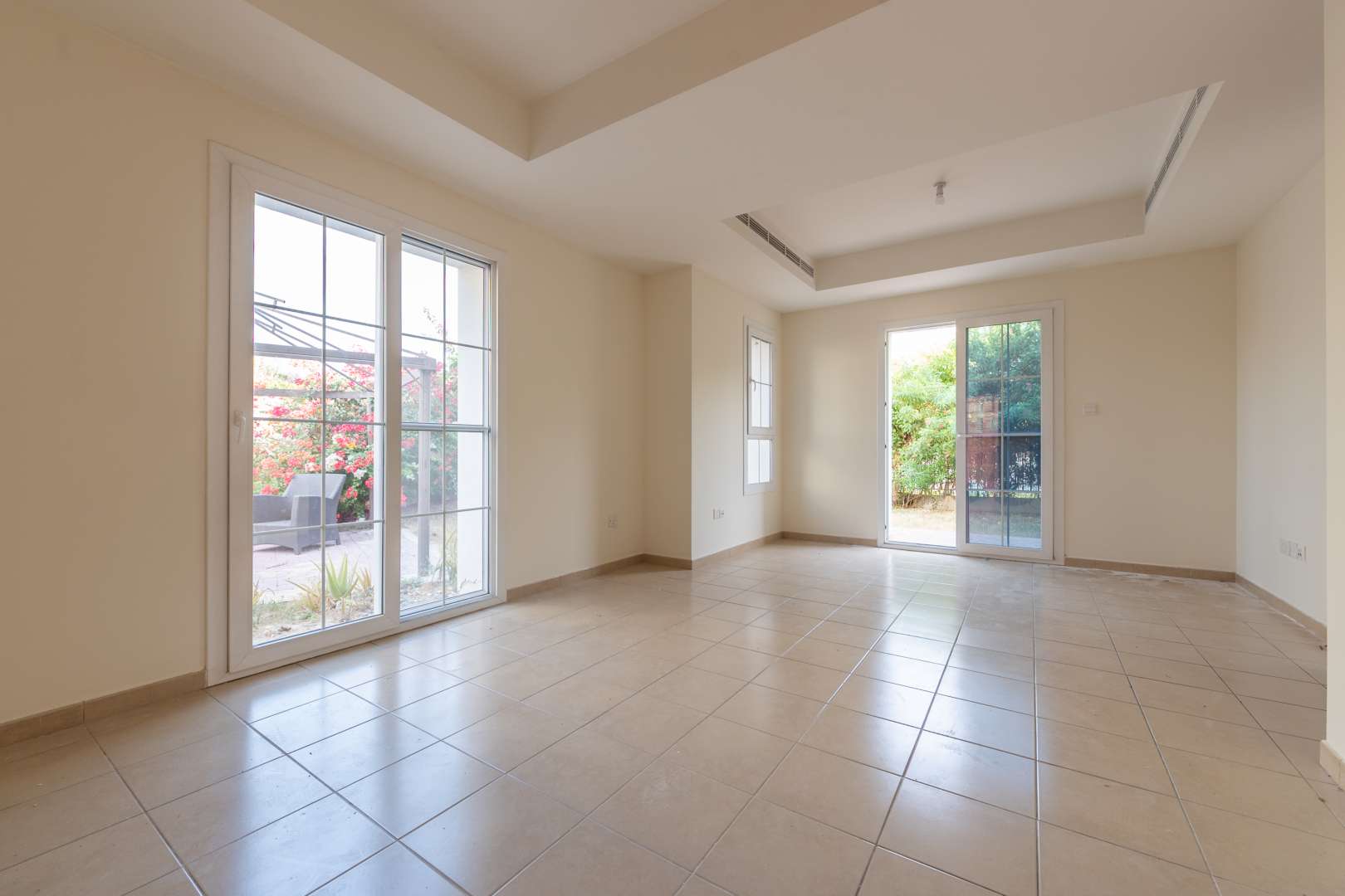 Spacious living area in 3-bedroom villa, Ghadeer, The Lakes, Dubai, with large windows