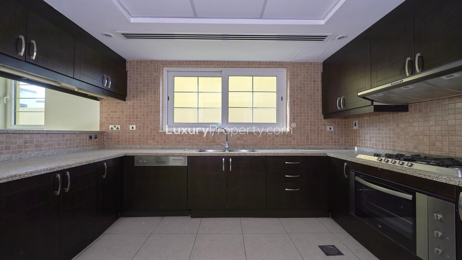 Spacious open-plan kitchen and living area in Jumeirah Park Legacy villa for rent