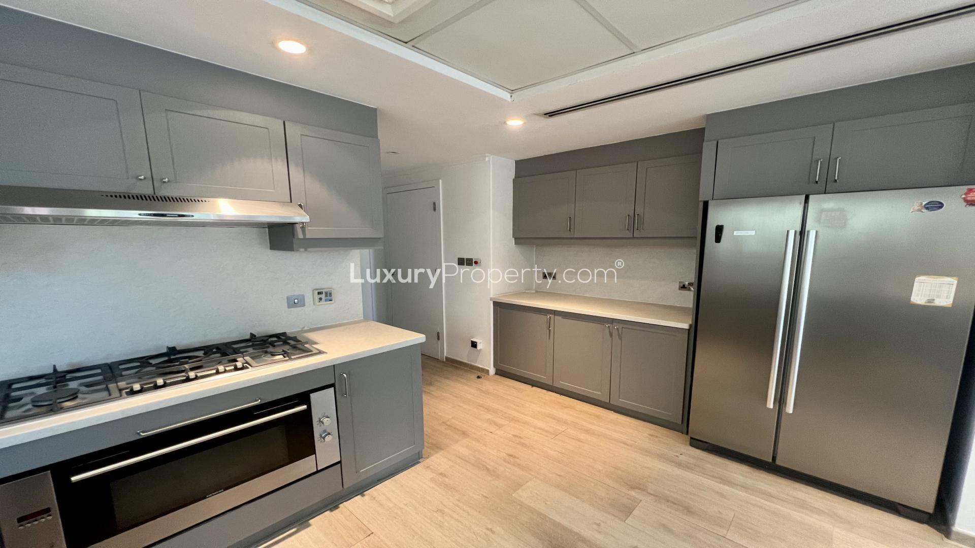 Upgraded villa interior with open kitchen in Jumeirah Park, Legacy community, for rent