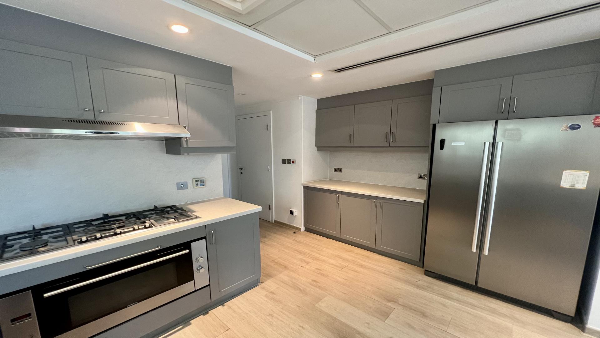 Upgraded villa interior with open kitchen in Jumeirah Park, Legacy community, for rent