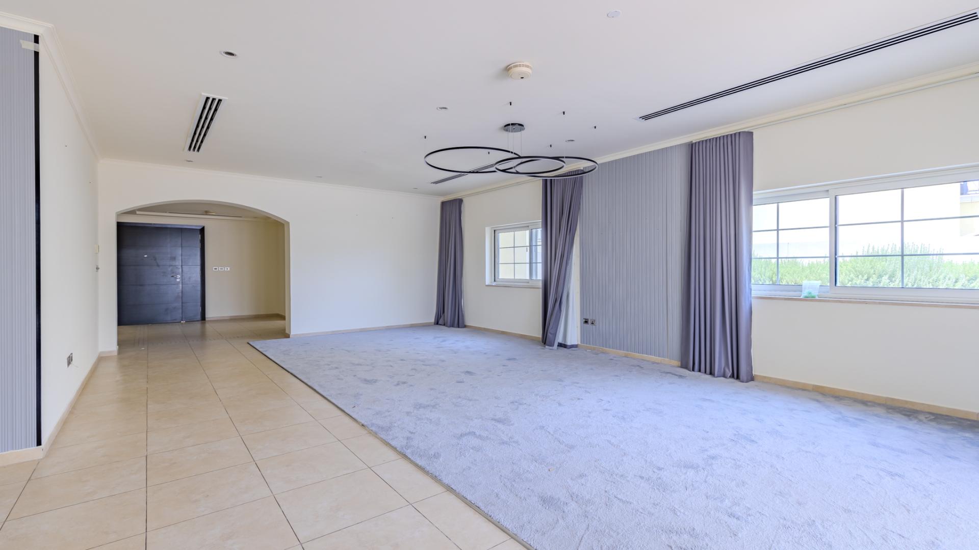 Spacious living area in Legacy Villa, Jumeirah Park, with modern design and elegant lighting