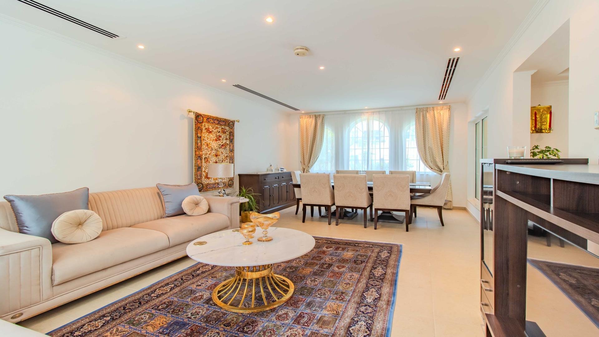 Outdoor patio with seating and pergola at Jumeirah Park Legacy Villa for rent