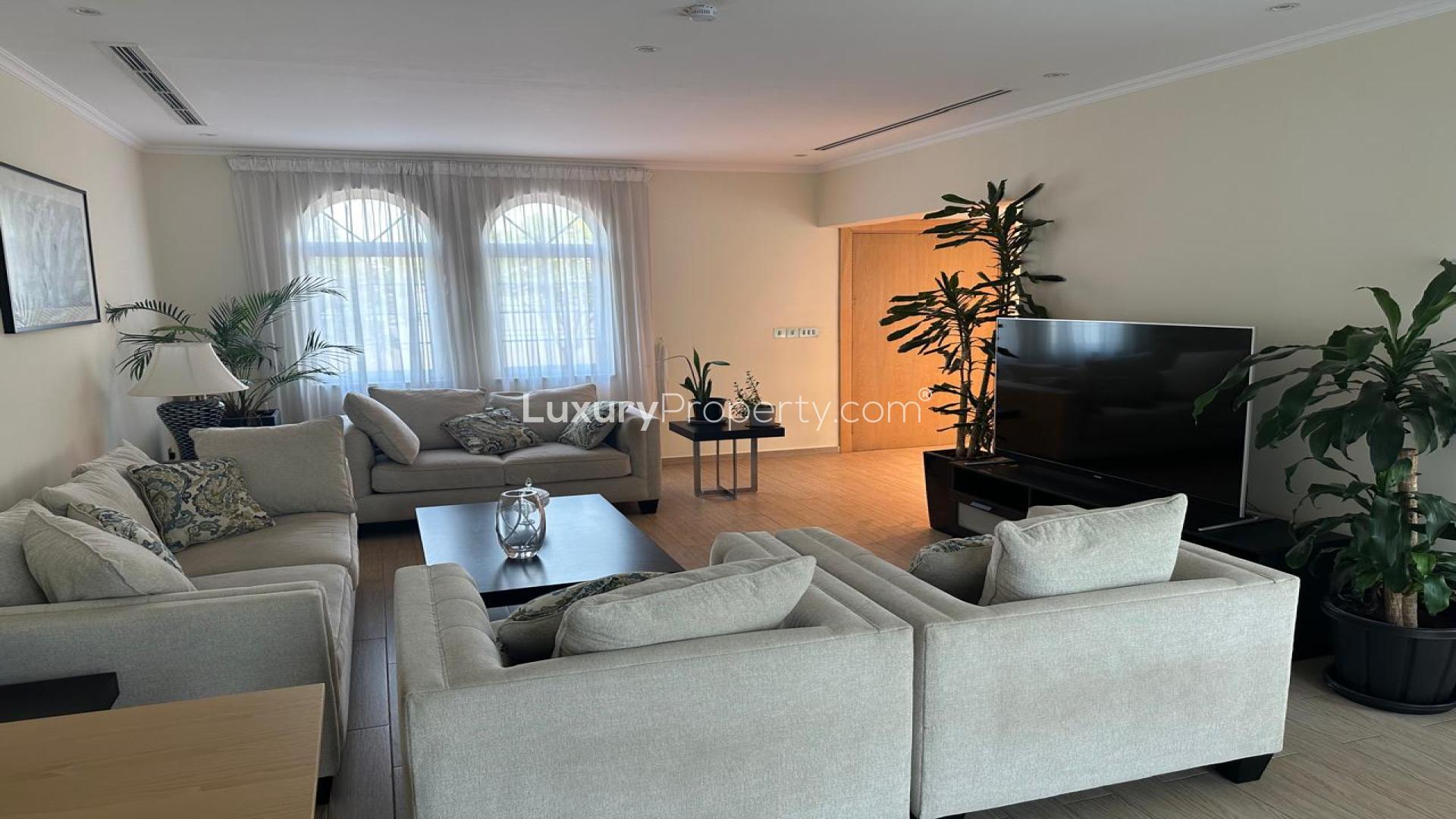 Luxurious outdoor seating by pool in Jumeirah Park, Legacy villa for rent