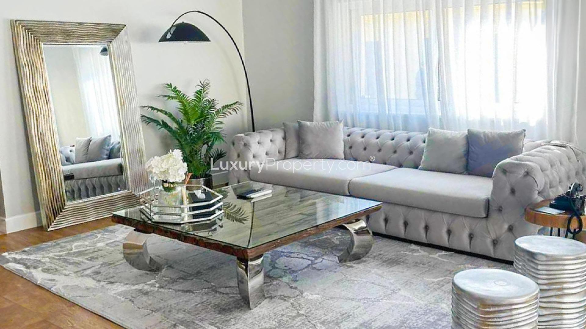 Luxurious living room in 3-bedroom villa, Jumeirah Park, Legacy, featuring elegant furnishings