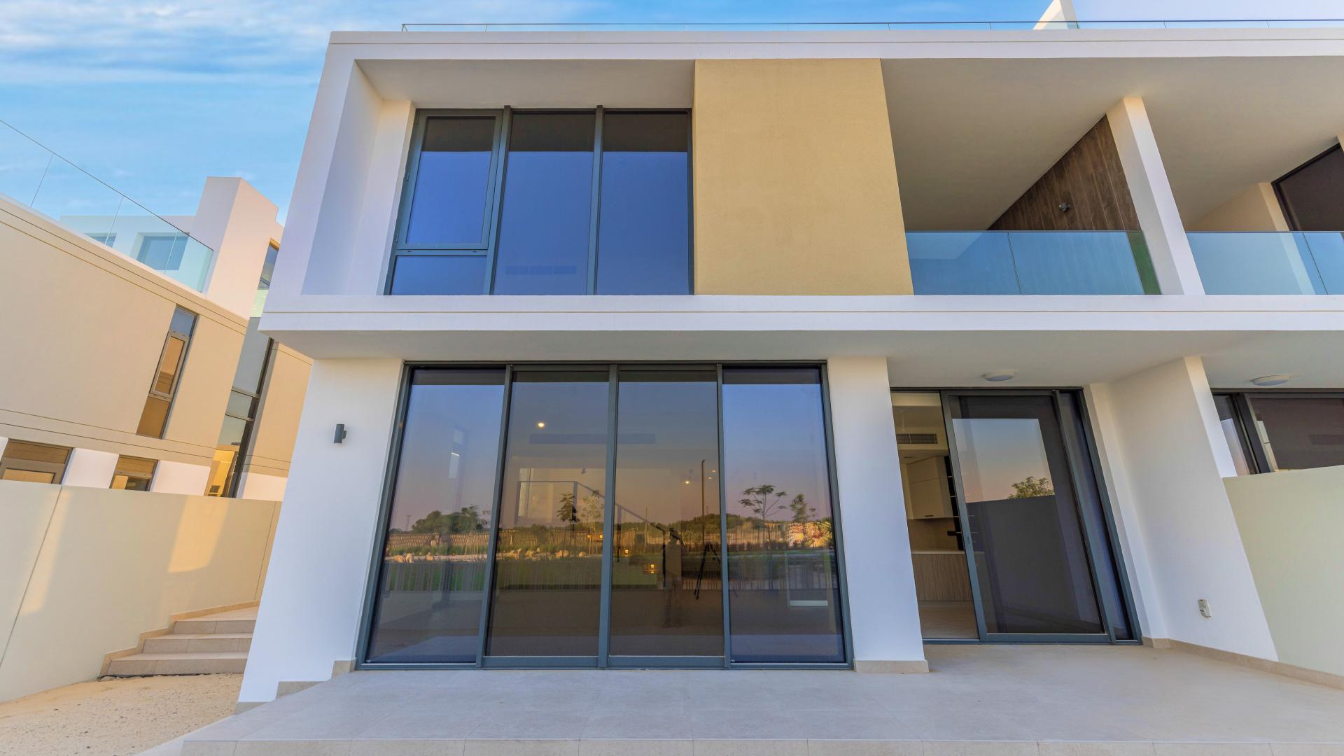 Modern kitchen with large windows in Dubai Hills Estate villa, Golf Grove community