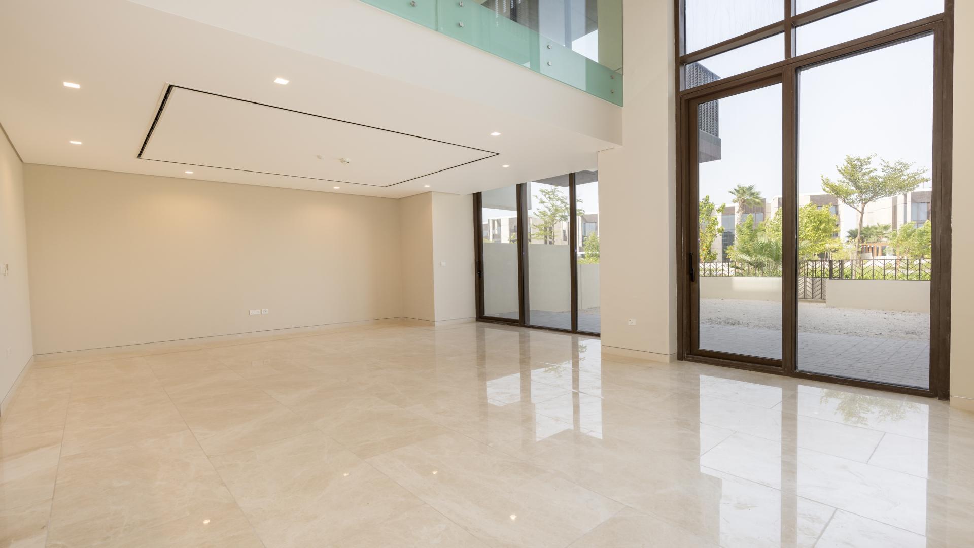 "Spacious modern kitchen in luxury Jumeirah Bay Island villa for rent with sea views.",Spacious living area with large windows in luxury Jumeirah Bay Island villa for rent