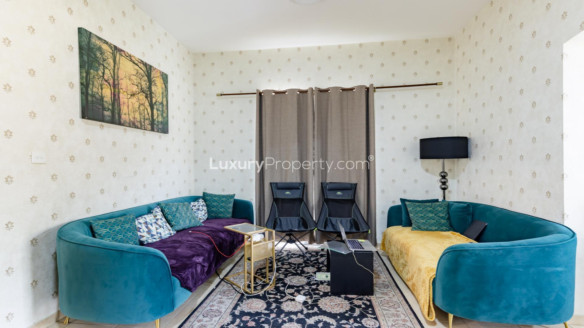 Exterior view of elegant villa with patio and garden in Al Reem, Arabian Ranches