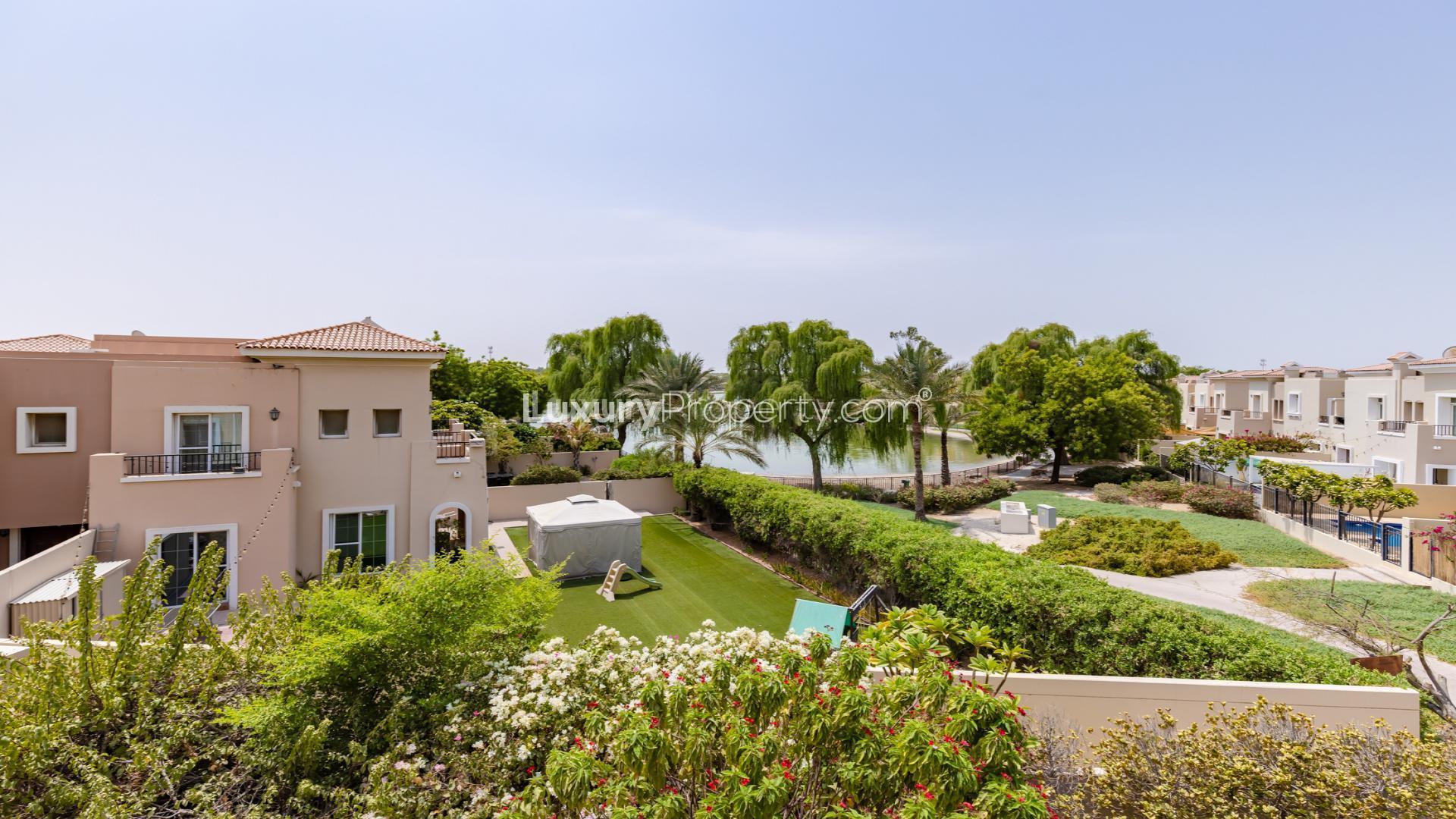 Bright living room in Al Reem villa, Arabian Ranches, with modern decor and garden view