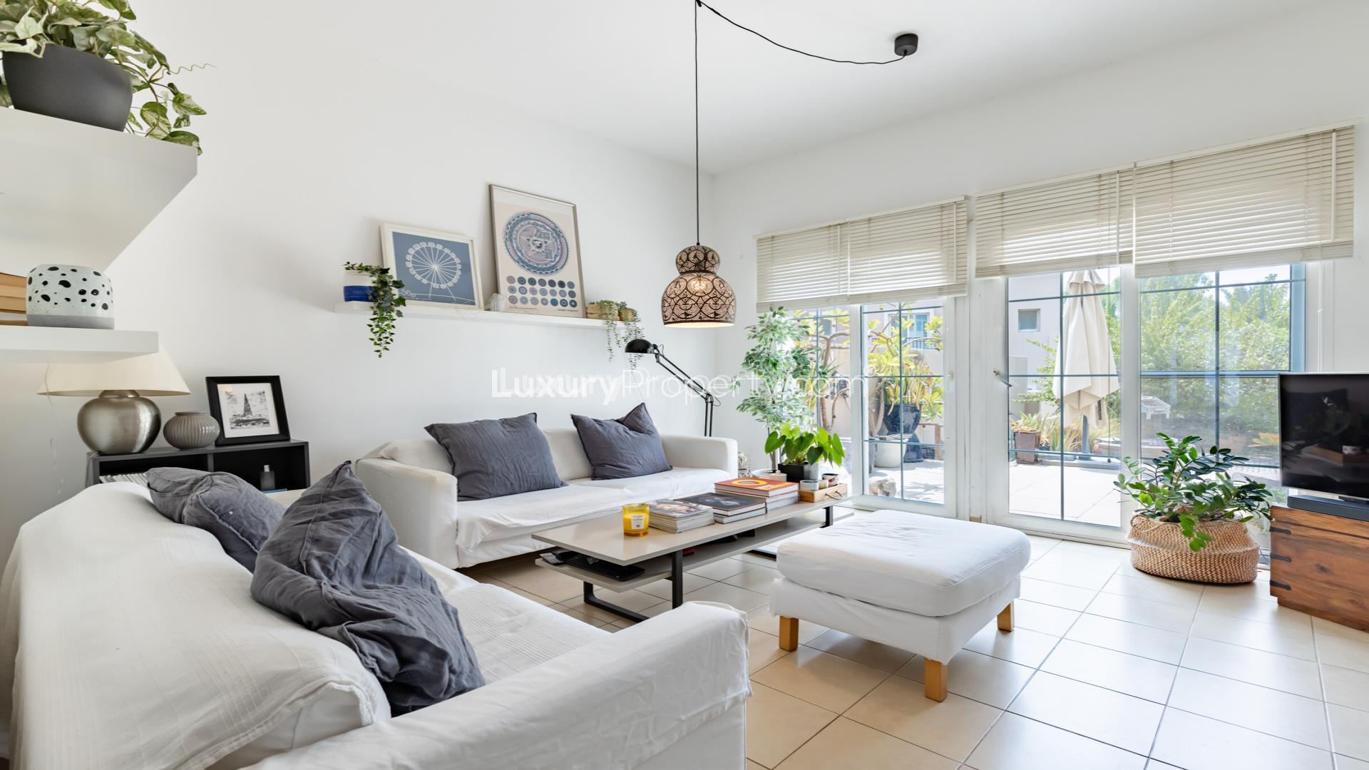 Exquisite 4-bedroom villa exterior with lush garden in Al Reem, Arabian Ranches