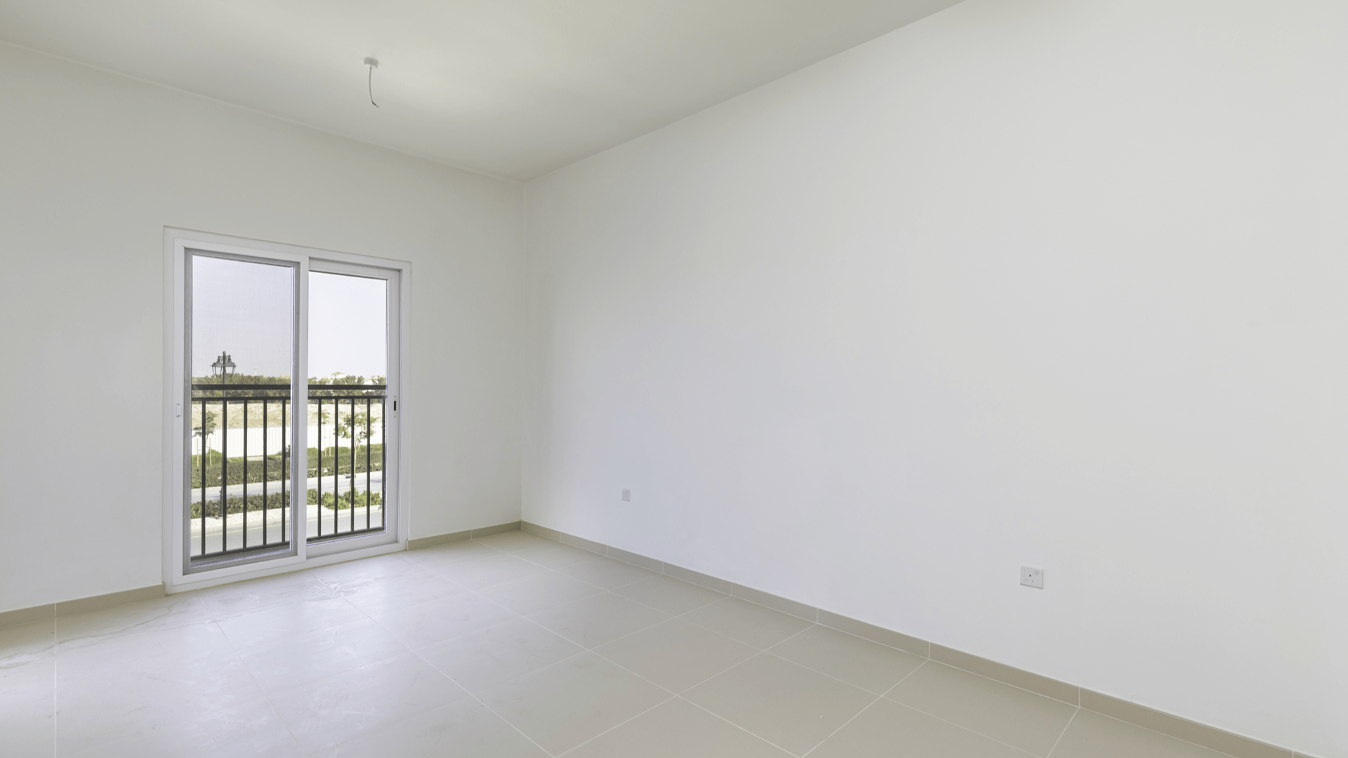 Empty bedroom with built-in wardrobe in Villanova, Dubai Land villa for rent