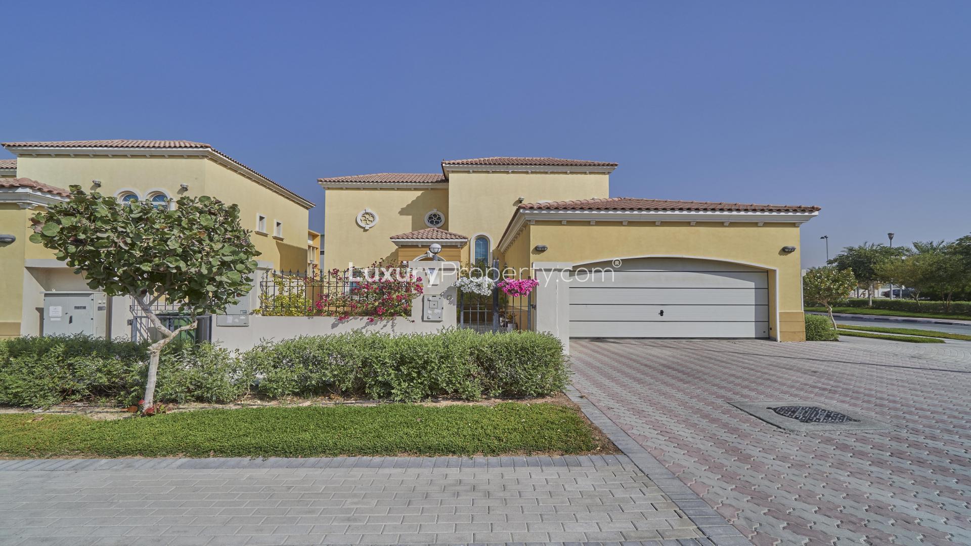 Jumeirah Park villa with private garden, patio seating, and stylish exterior in Legacy community