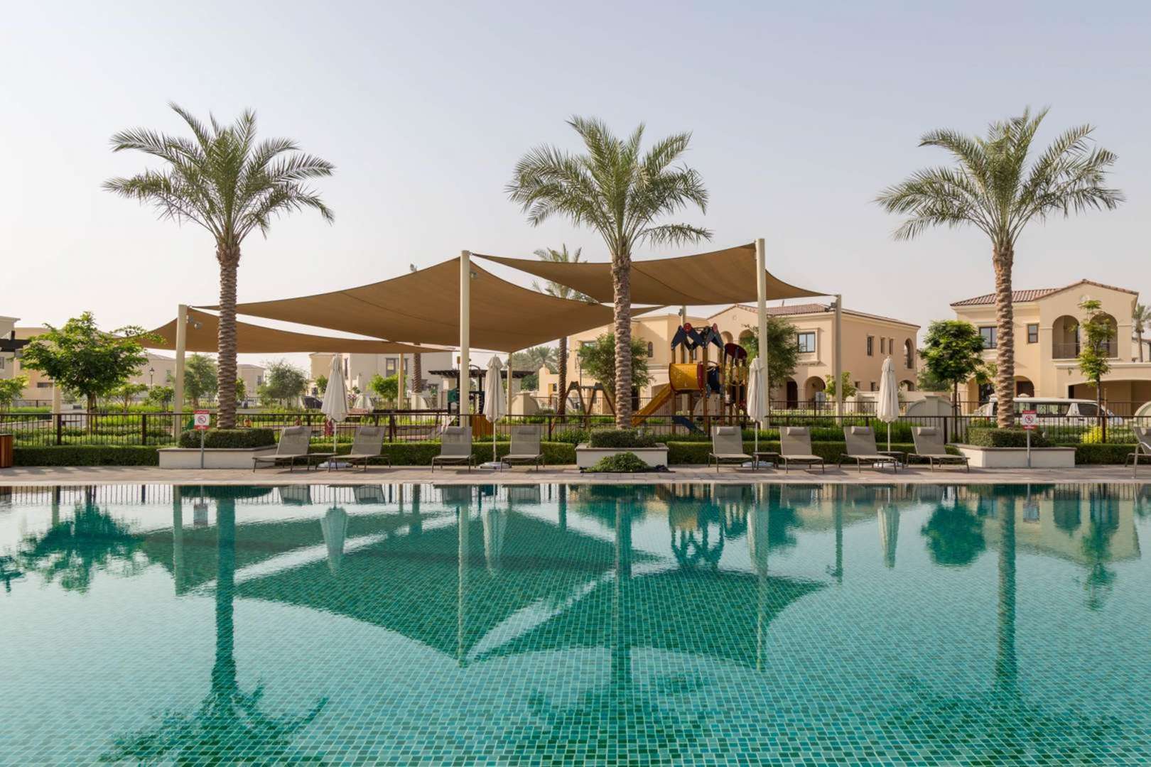Charming three-bedroom villa exterior in Lila, Arabian Ranches 2, with driveway and garage