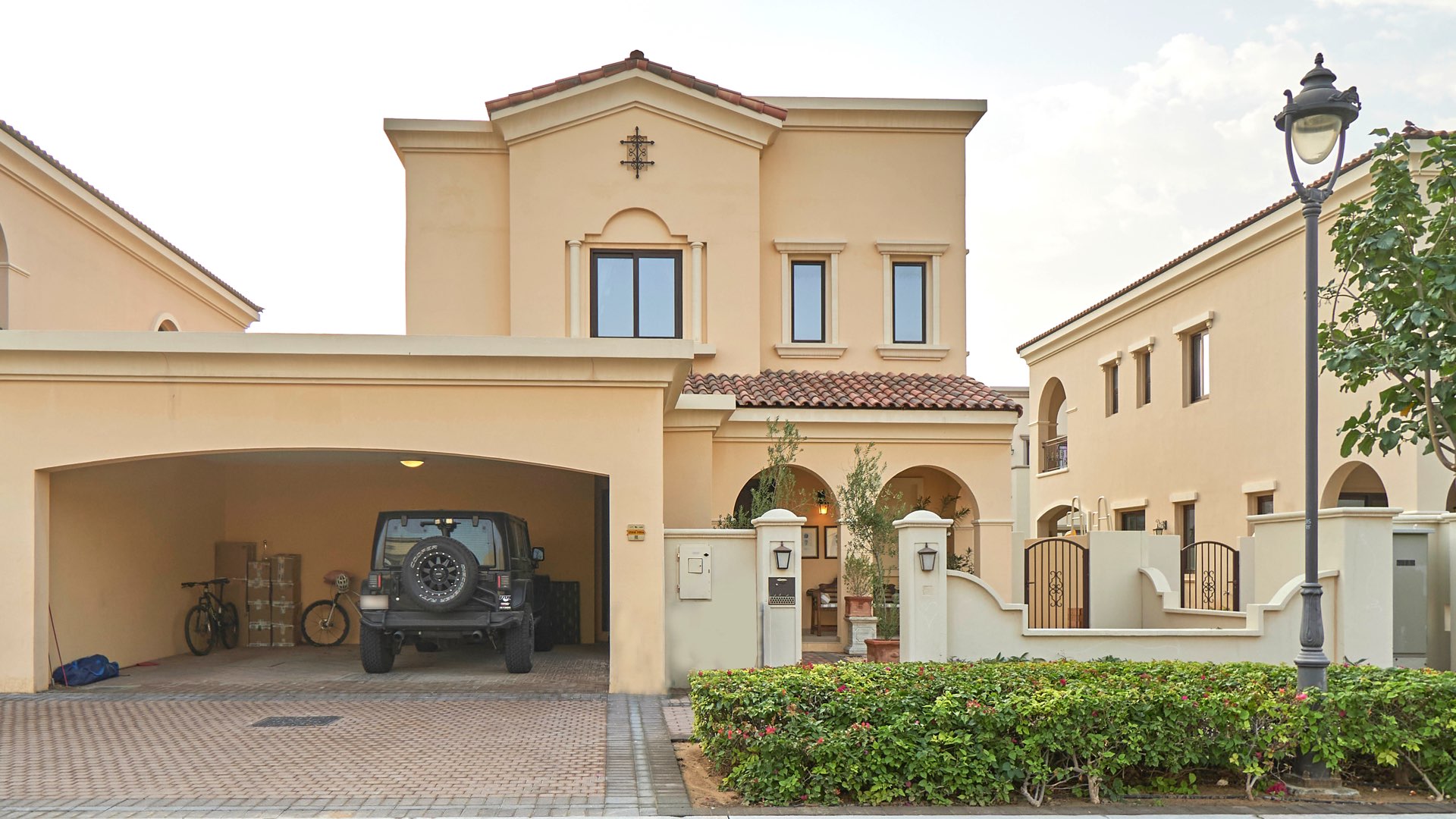 Spanish-style villa exterior with garage in Arabian Ranches 2, Lila community