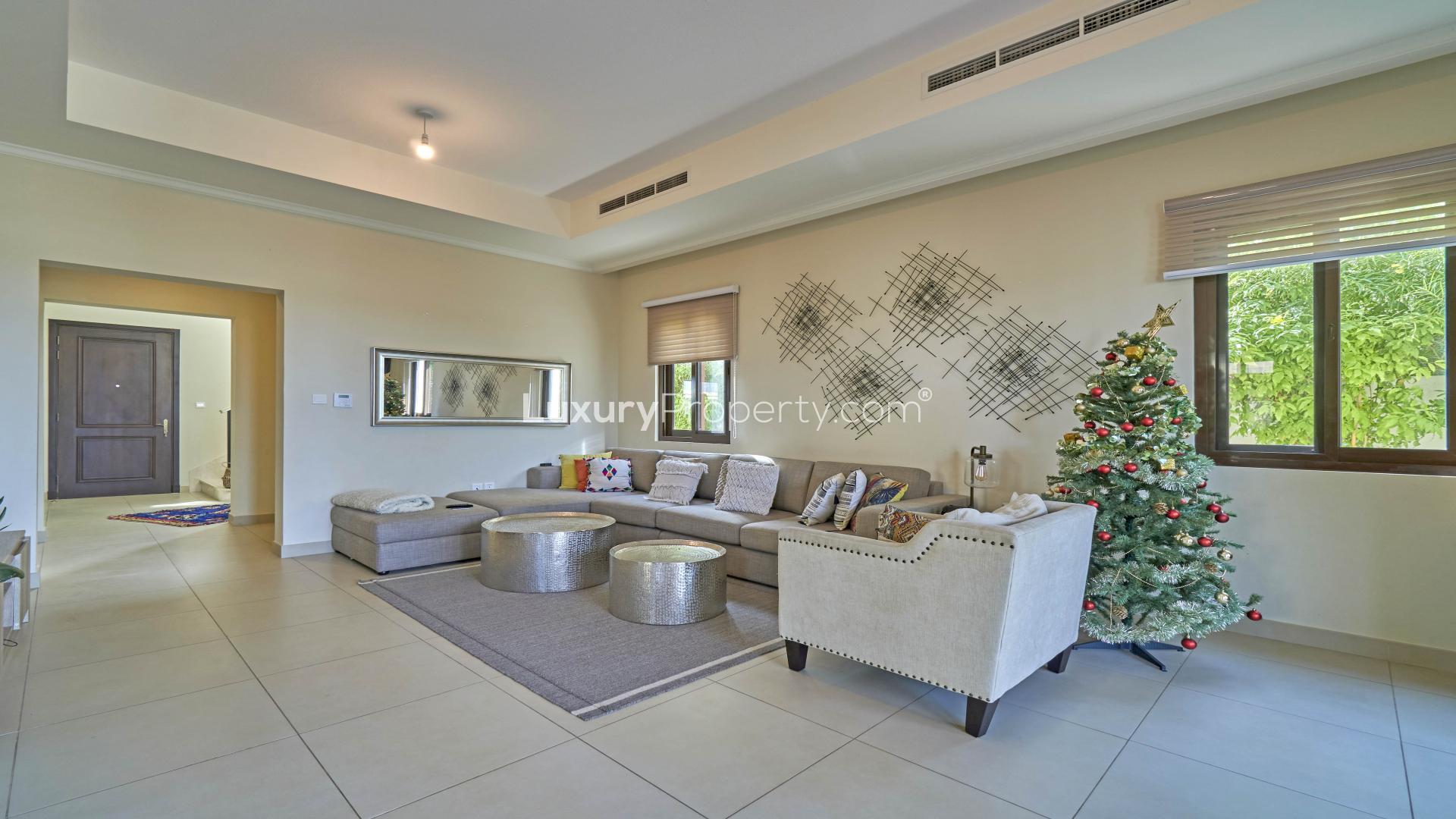 Outdoor view of Arabian Ranches 2 villa with patio and garden furniture