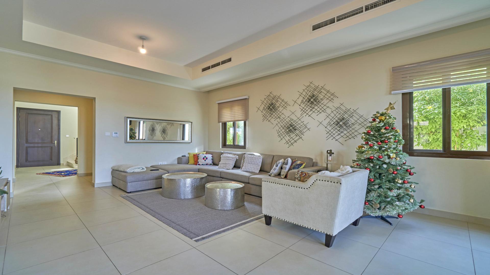 Outdoor view of Arabian Ranches 2 villa with patio and garden furniture