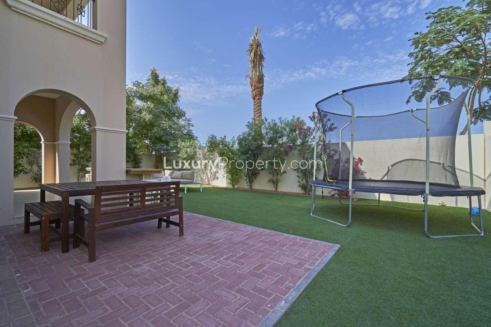 Stunning villa entrance with arched porch and garden in Lila, Arabian Ranches 2