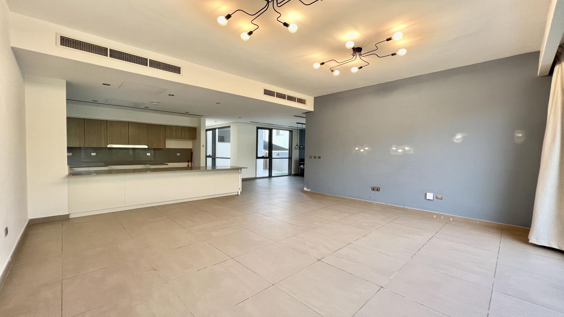 Modern living room with garden view in Sidra Villas, Dubai Hills Estate