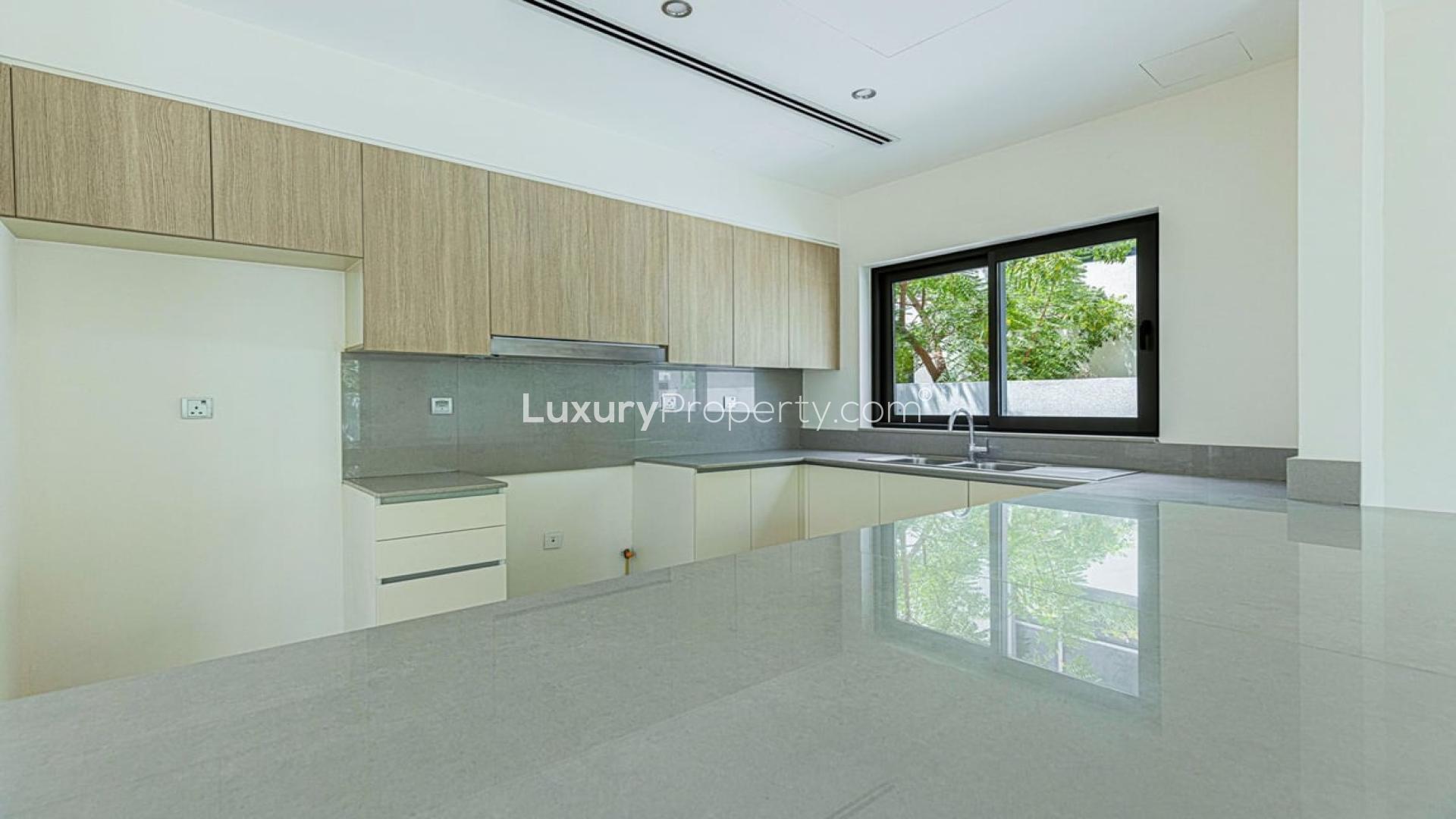 Modern kitchen in 3-bedroom villa, Sidra Villas, Dubai Hills Estate, with sleek countertops and cabinets
