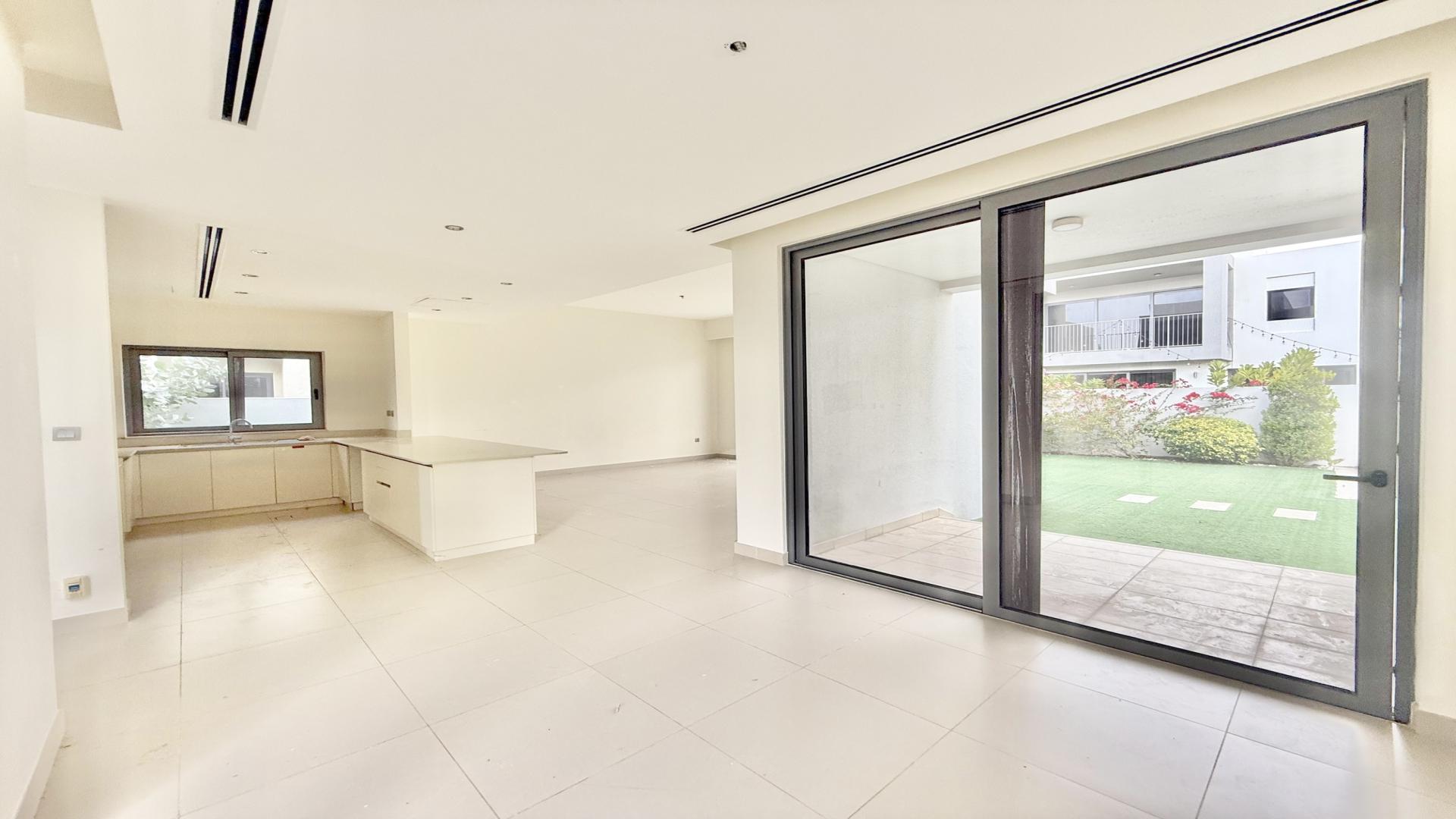 N/A,Empty living room with large windows in Sidra Villas, Dubai Hills Estate
