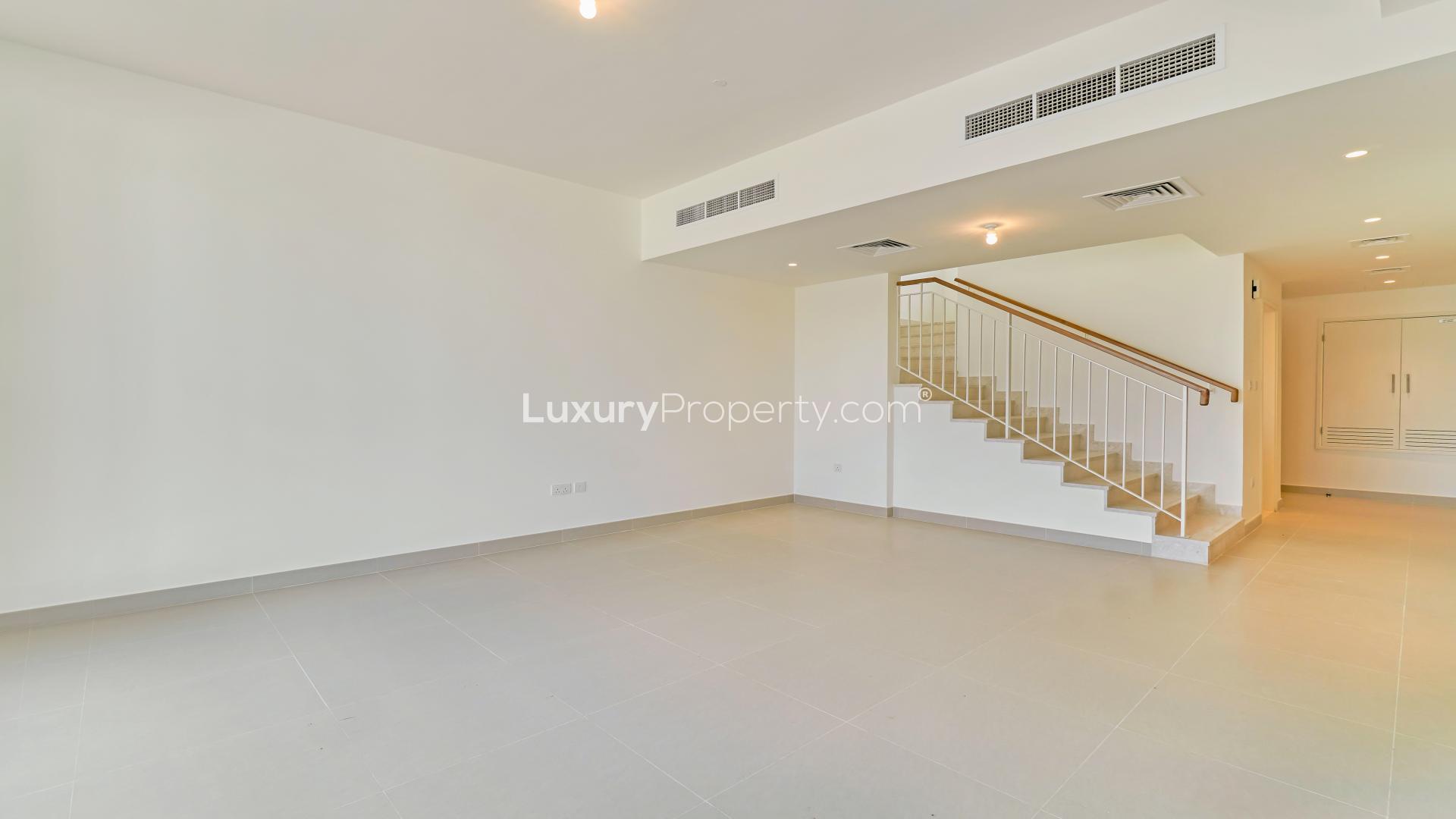 Outdoor pool view at Maple, Dubai Hills Estate villa community under clear blue sky