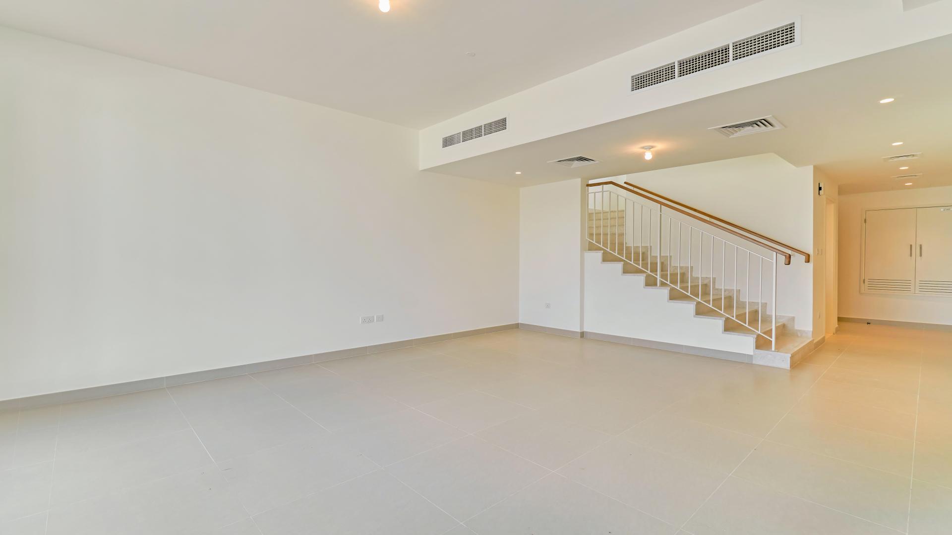 Outdoor pool view at Maple, Dubai Hills Estate villa community under clear blue sky