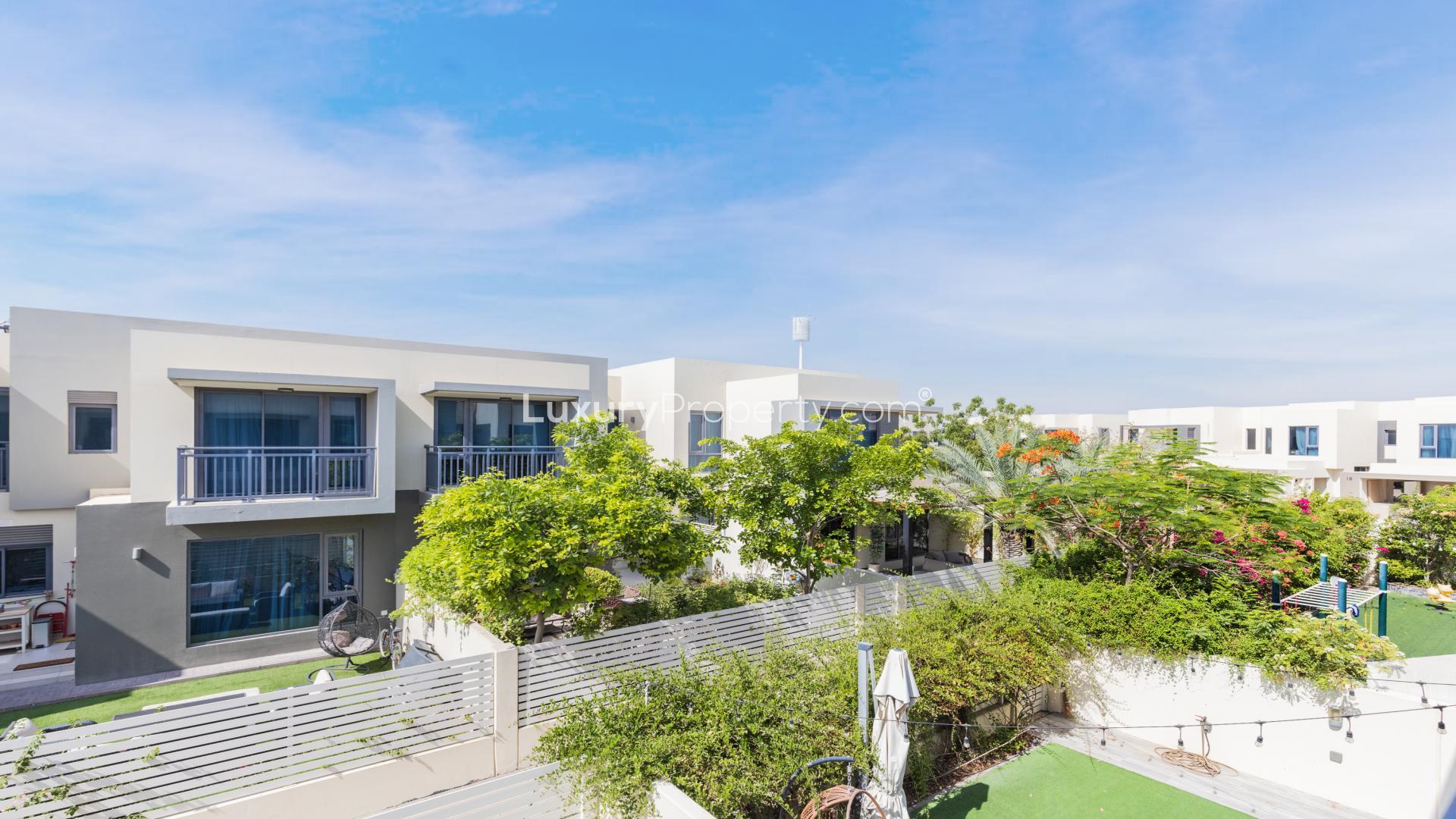 Tranquil villa exterior with lush garden in Maple, Dubai Hills Estate, available for rent