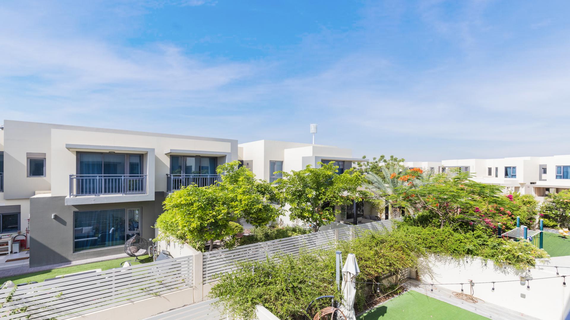 Tranquil villa exterior with lush garden in Maple, Dubai Hills Estate, available for rent