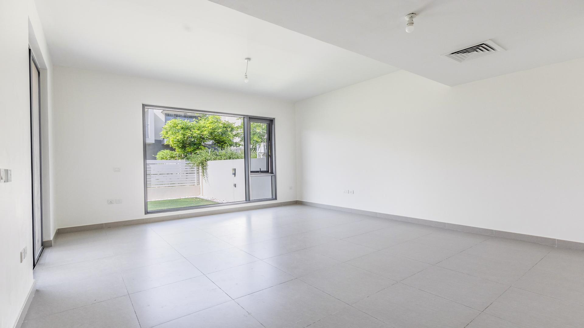 Spacious living room with garden view in 3-bedroom villa, Maple, Dubai Hills Estate