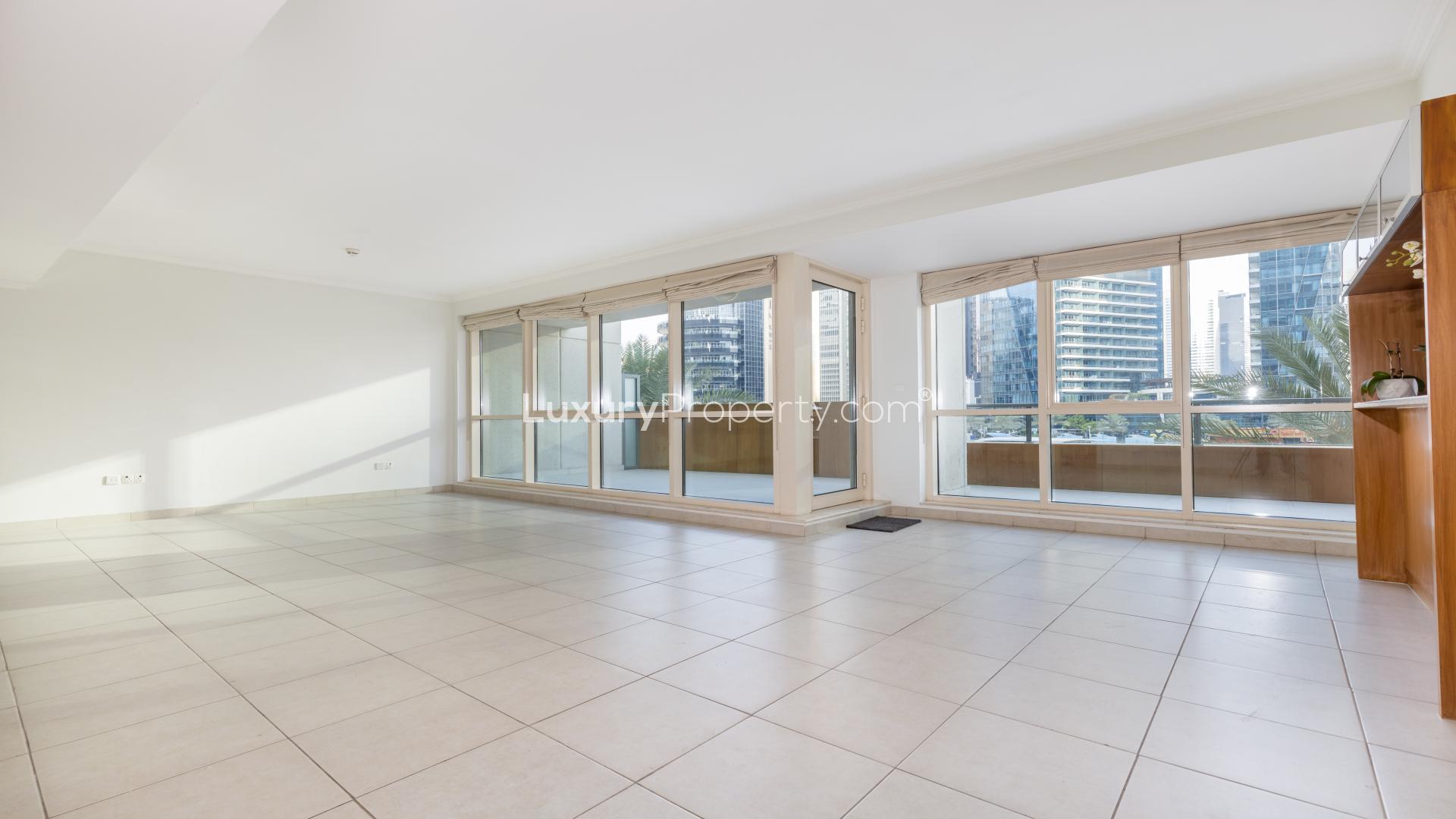 Spacious living room in 3-bedroom duplex, Marina Quays, Dubai Marina, with large windows and city view