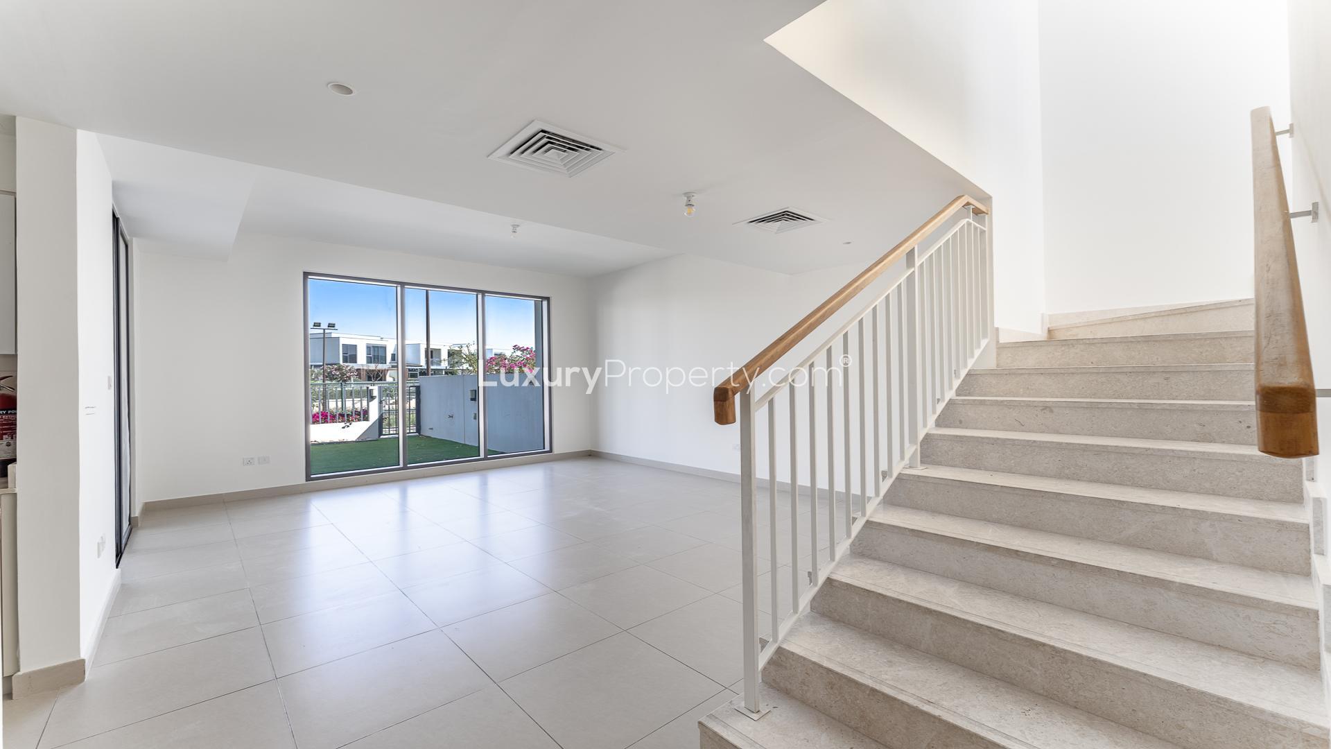 Bright living area with stairway in Dubai Hills Estate villa for rent, Maple community