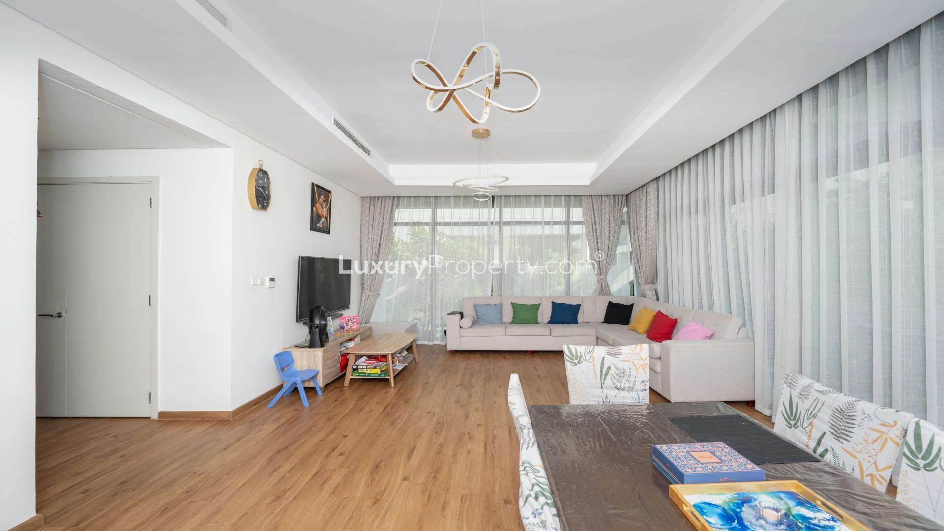 Spacious living room in 3-bedroom villa, Akoya Park, DAMAC Hills, with modern decor