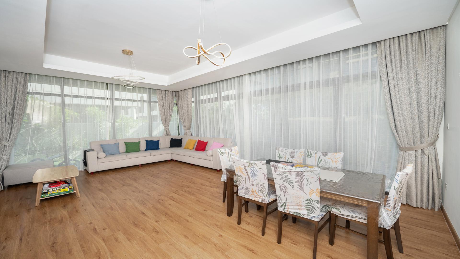 Exterior of spacious 3-bedroom villa in Akoya Park, Damac Hills, with modern design and driveway